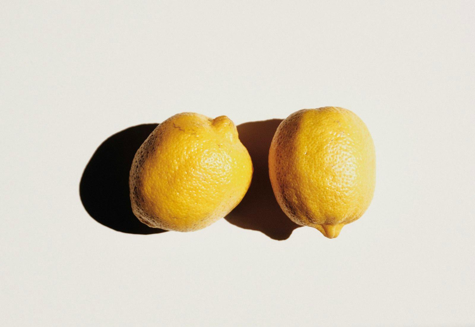 2 Yellow Lemon Fruits On White Surface jigsaw puzzle preview