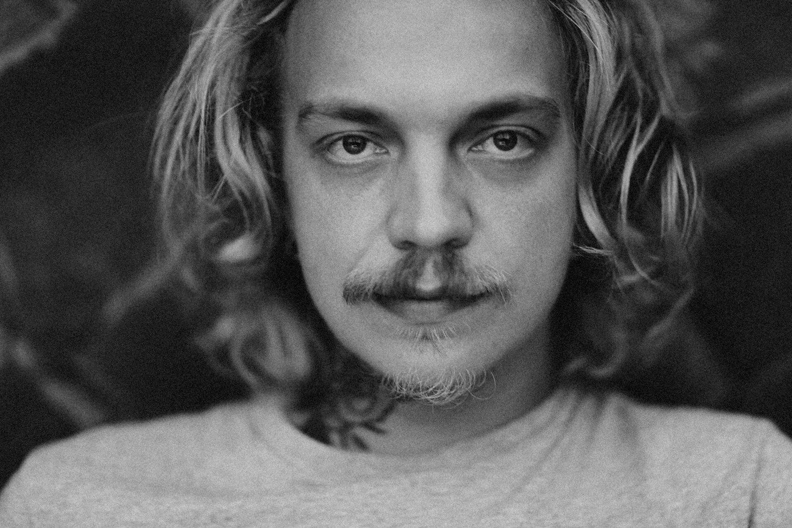 A Black And White Photo Of A Man With Long Hair jigsaw puzzle preview