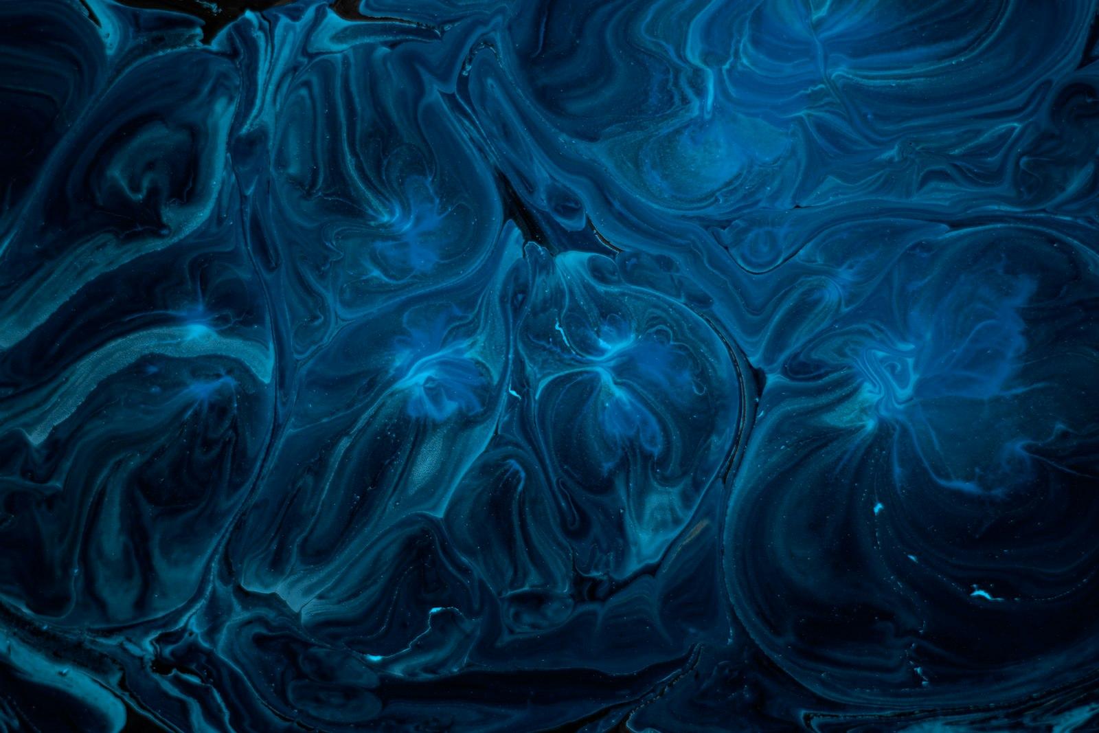 A Blue And Black Background With Swirls jigsaw puzzle preview