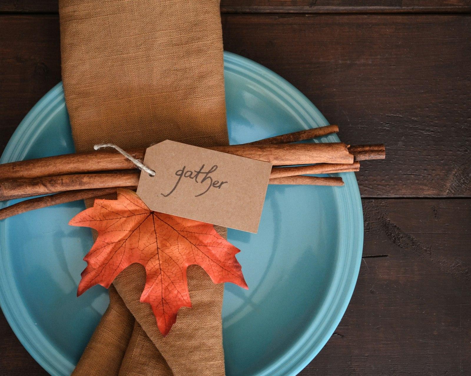 A Blue Plate Topped With An Orange And Brown Leaf jigsaw puzzle preview
