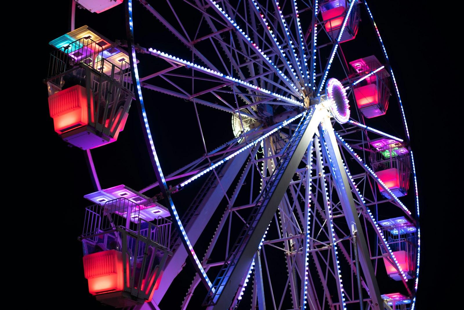 A Brightly Lit Ferris Wheel Glows Against The Nigh jigsaw puzzle preview