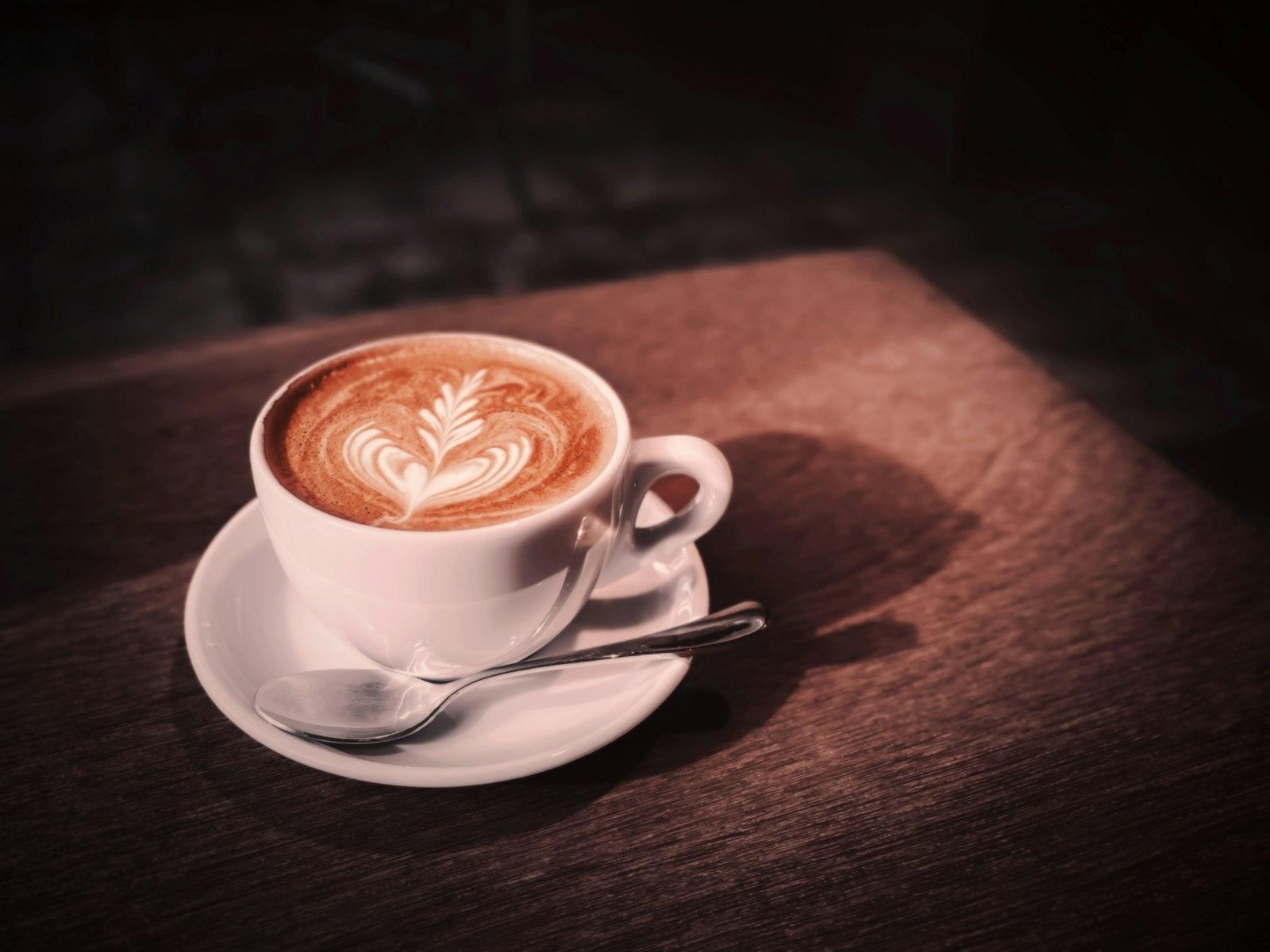 A Cappuccino On A Saucer On A Wooden Table jigsaw puzzle preview