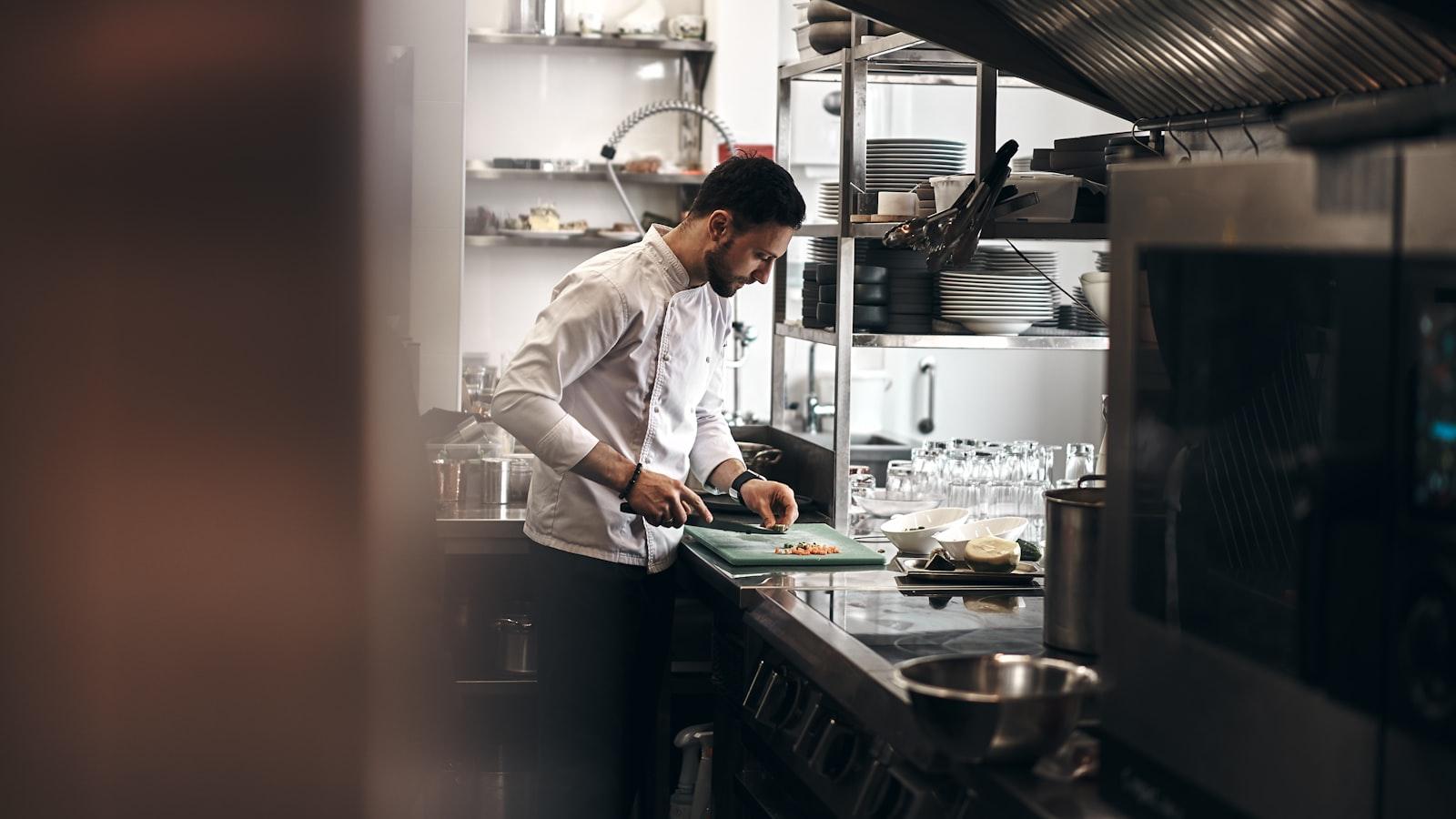 A Chef Dressed In A White Coat Working In A Kitche jigsaw puzzle preview