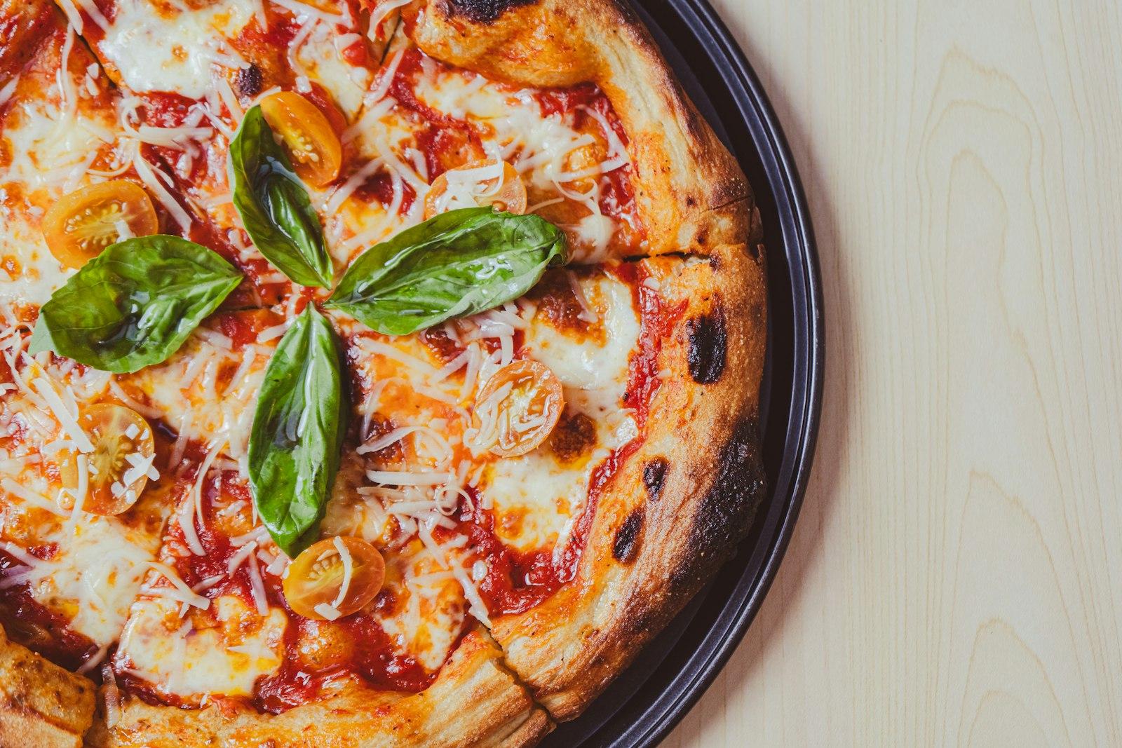 A Close Up Of A Pizza On A Plate On A Table jigsaw puzzle preview