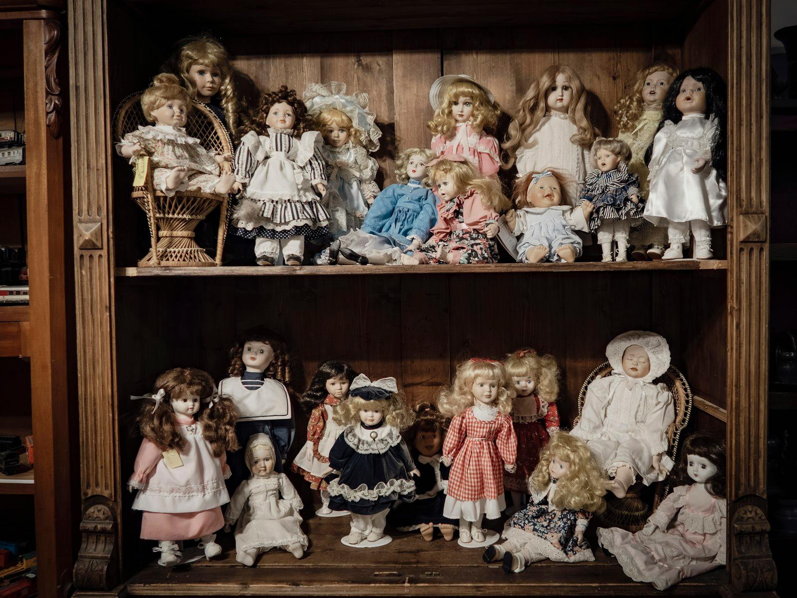 A Collection Of Vintage Dolls Displayed On Wooden jigsaw puzzle preview