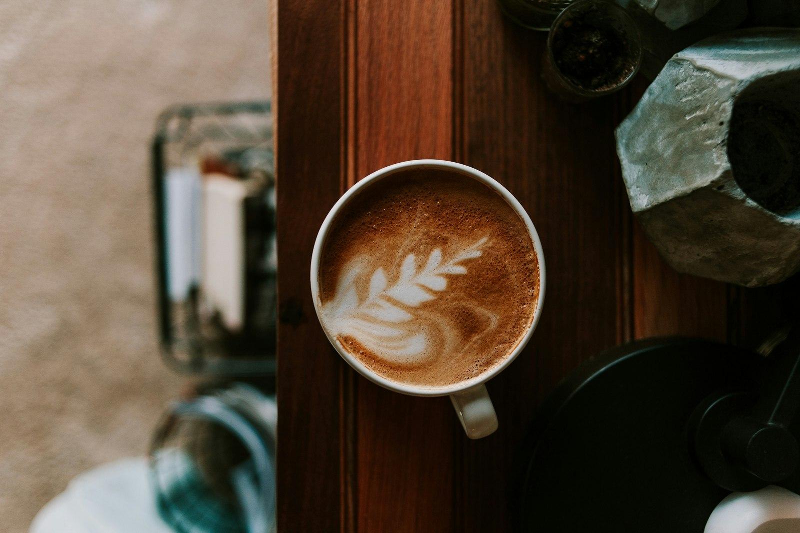A Cup Of Coffee On A Table Next To A Blender jigsaw puzzle preview