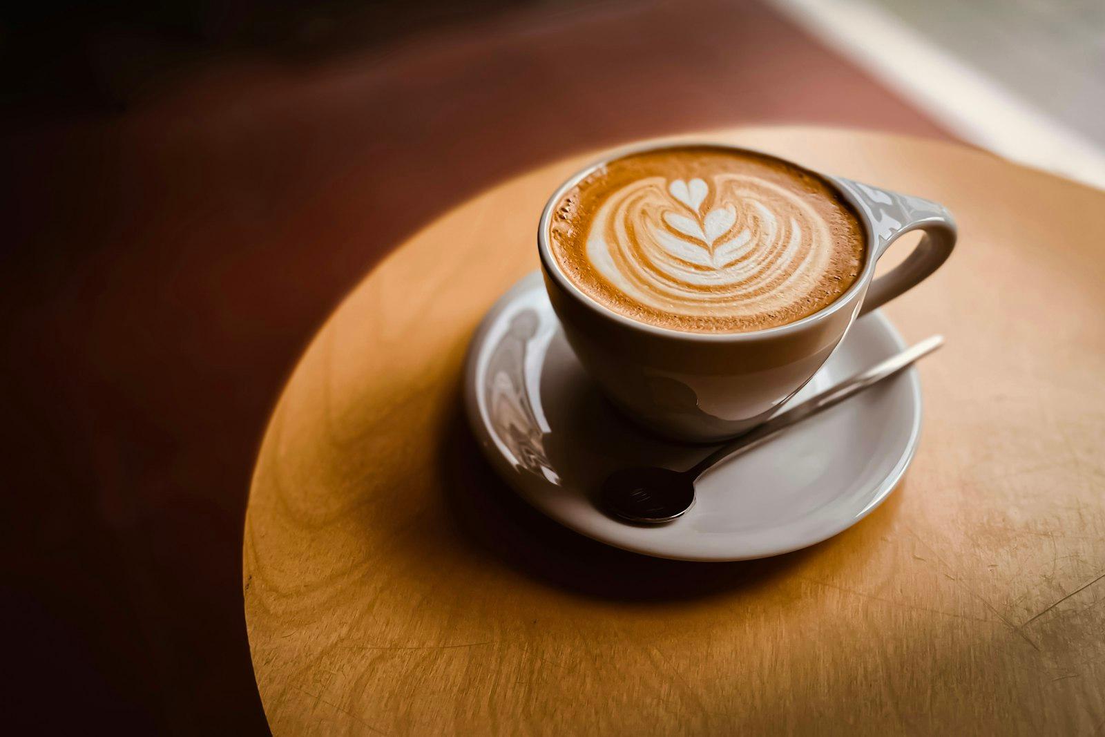 A Cup Of Coffee With Latte Art On A Saucer jigsaw puzzle preview