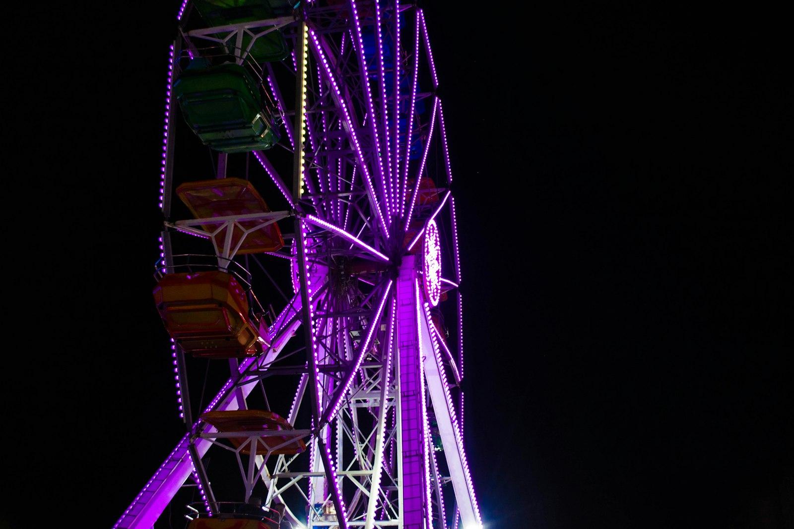 A Ferris Wheel Brightly Lit With Purple Lights At jigsaw puzzle preview