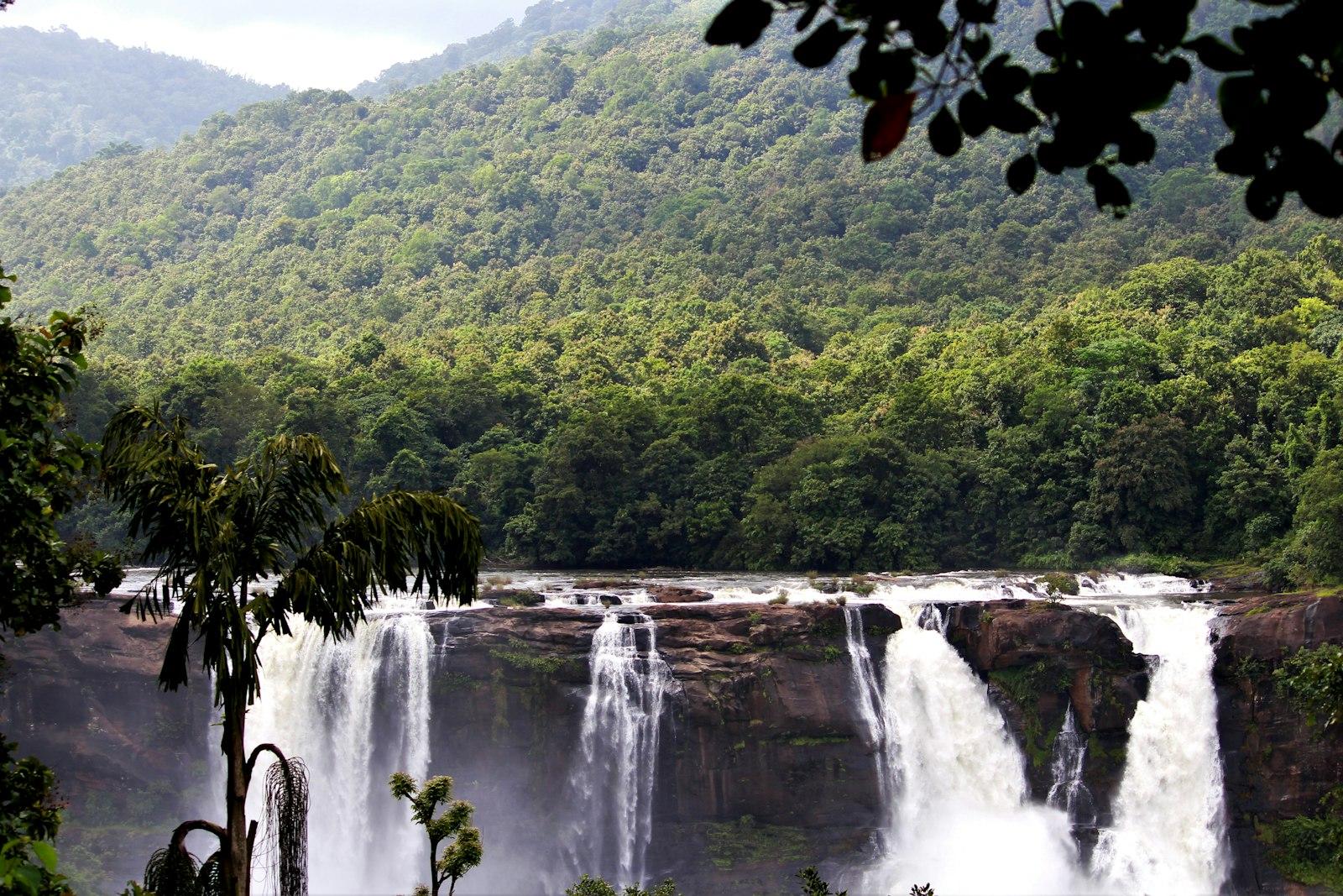 A Large Waterfall Surrounded By Lush Green Trees jigsaw puzzle preview