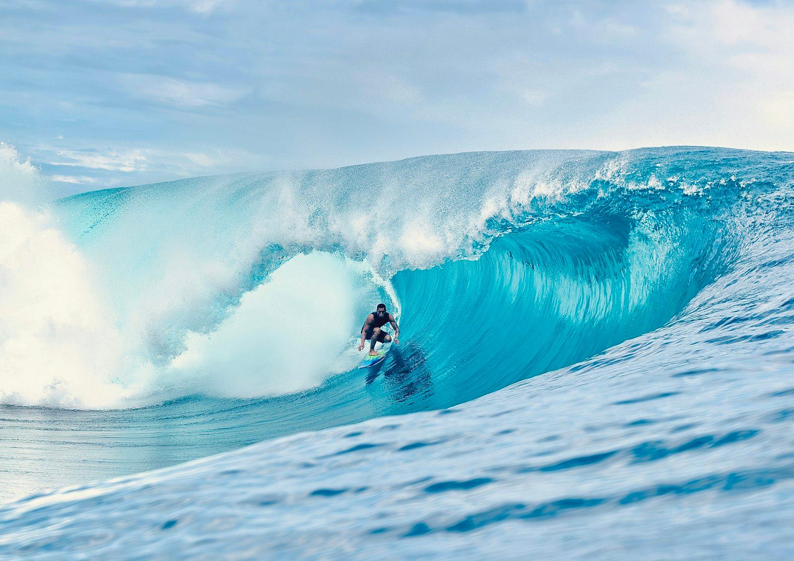 A Man Riding A Wave On Top Of A Surfboard jigsaw puzzle preview