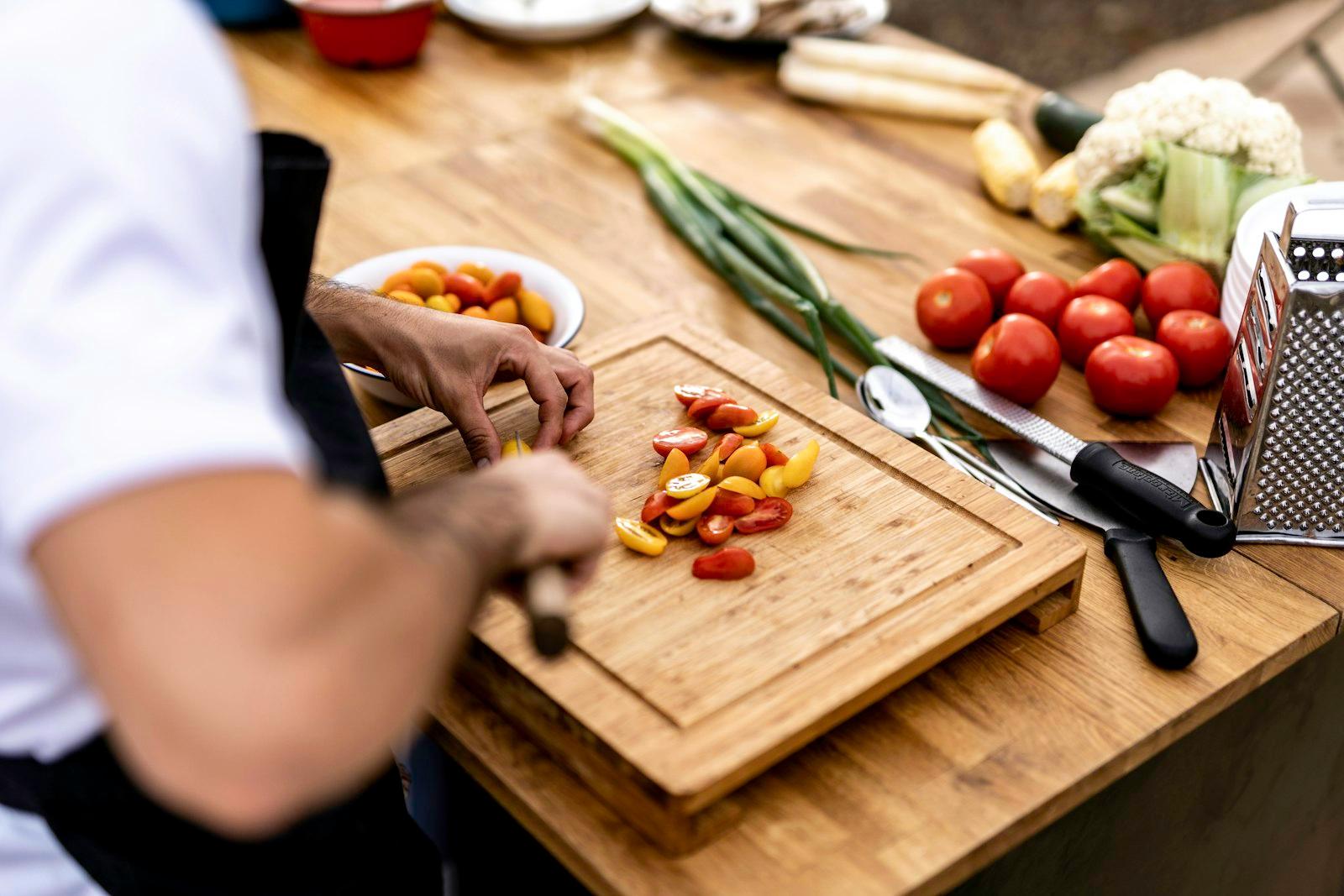 A Person Cutting Up Vegetables On A Cutting Board jigsaw puzzle preview