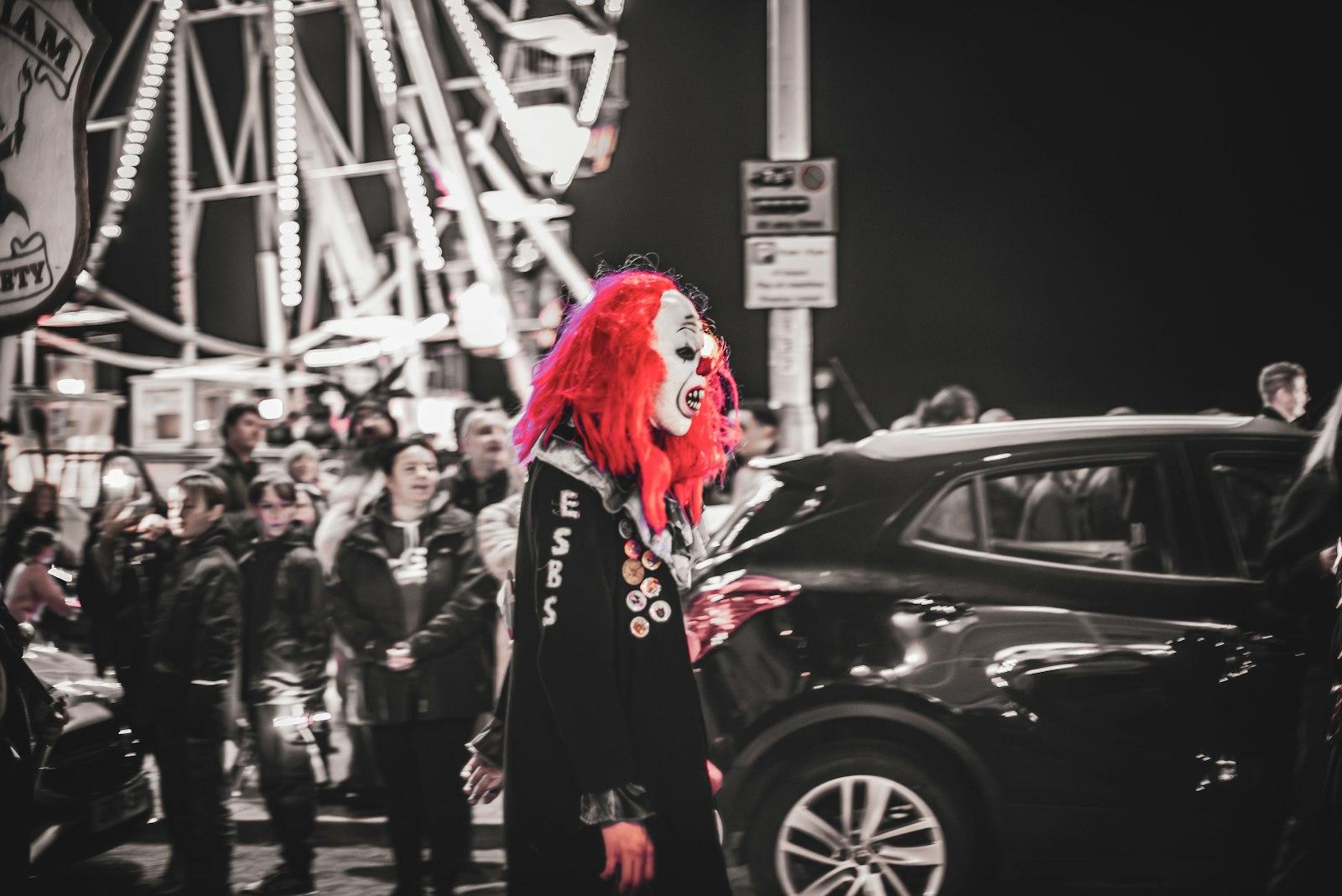 A Person In A Red Wig And Dark Costume Stands Out jigsaw puzzle preview