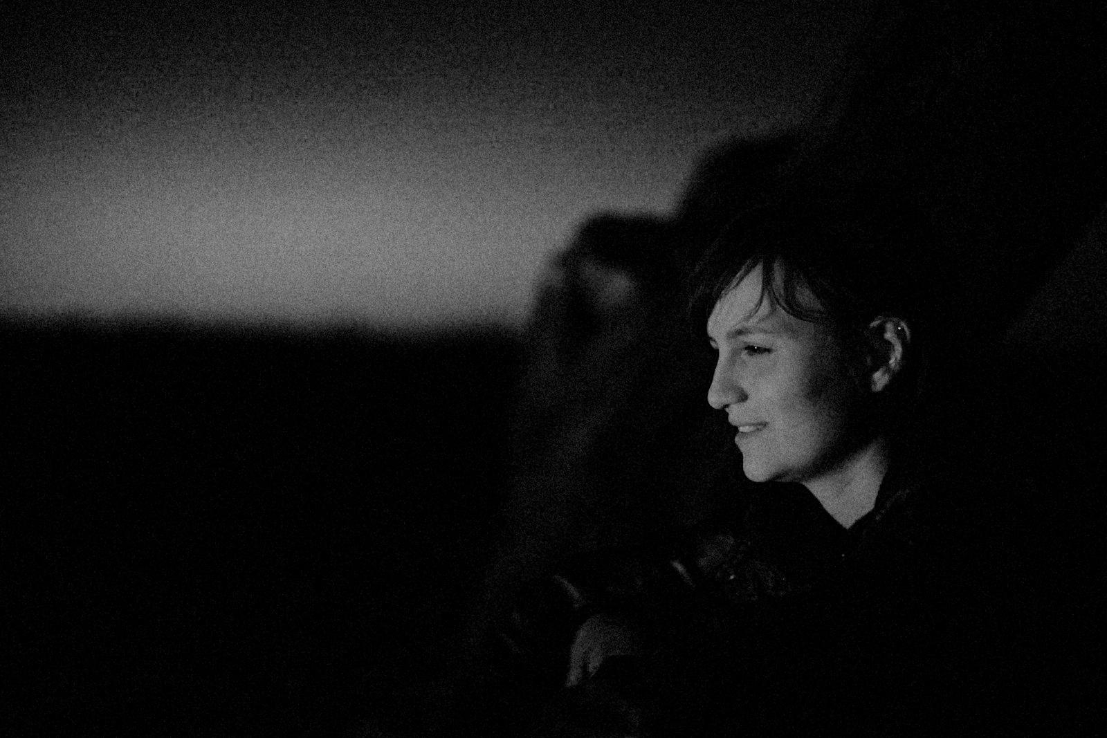 A Person Sitting In A Chair In The Dark jigsaw puzzle preview