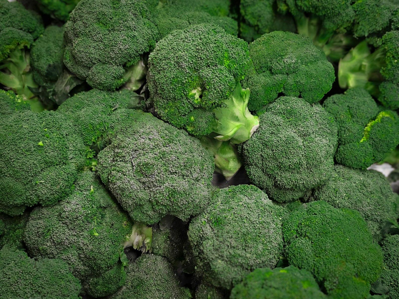 A Pile Of Green Broccoli Sitting Next To Each Othe jigsaw puzzle preview