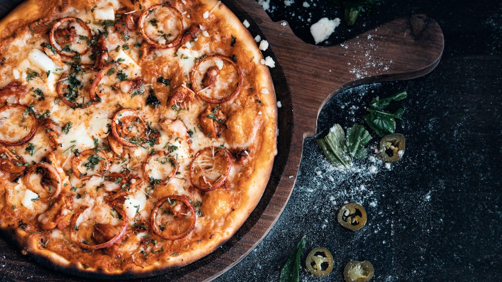 A Pizza Sitting On Top Of A Wooden Cutting Board jigsaw puzzle preview