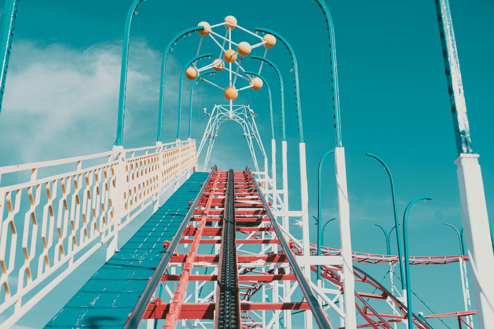 A Red And White Roller Coaster Against A Blue Sky jigsaw puzzle preview
