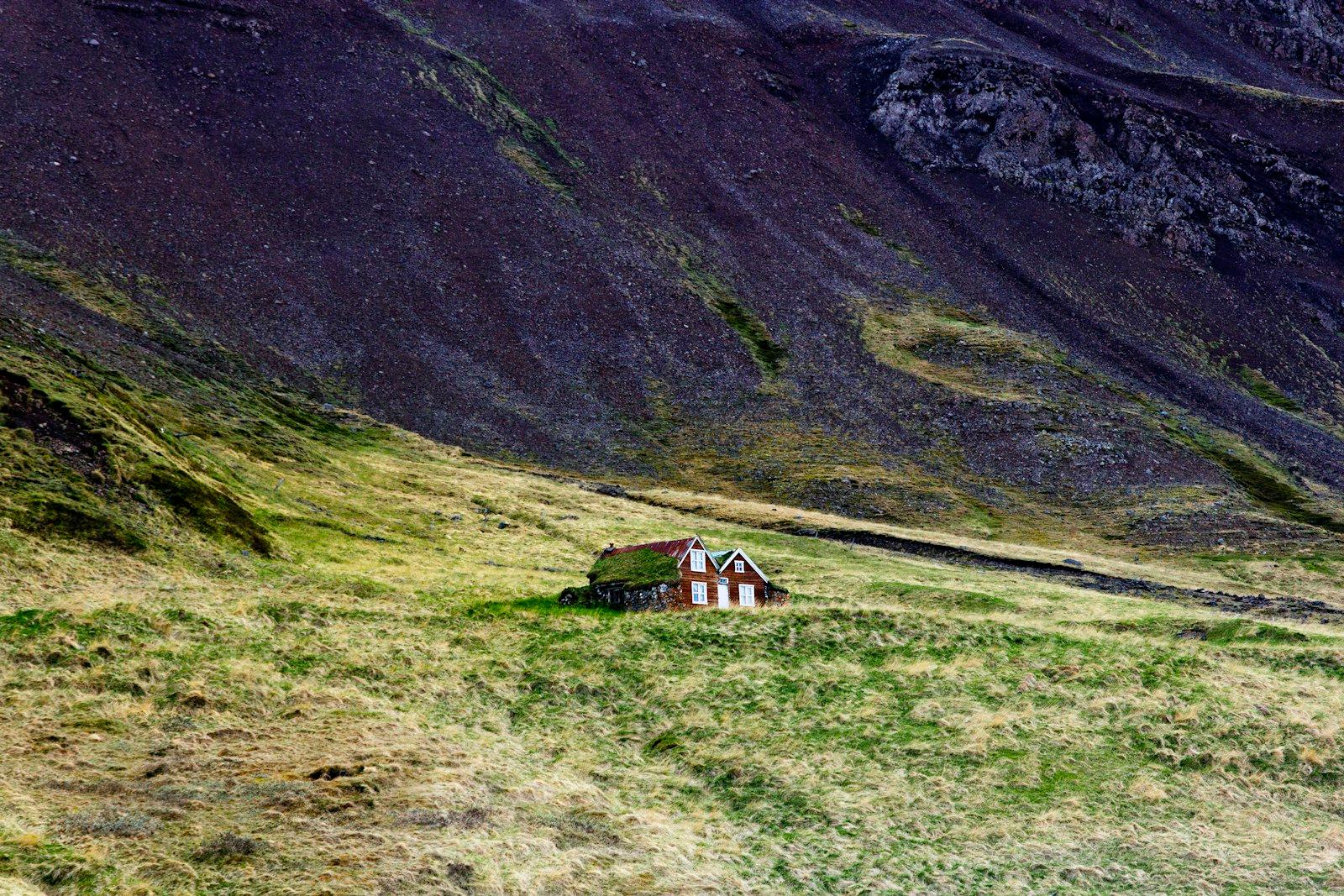 A Small House In The Middle Of A Grassy Field jigsaw puzzle preview