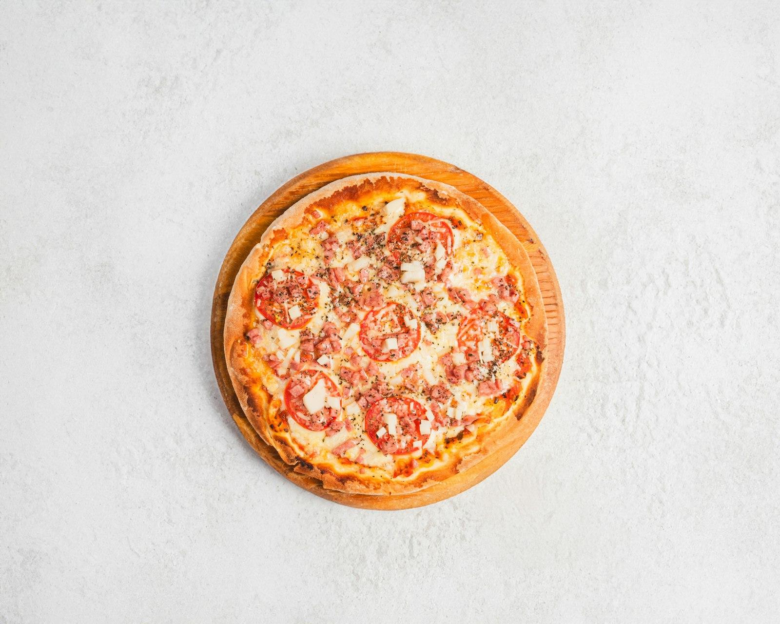 A Small Pizza Sitting On Top Of A White Table jigsaw puzzle preview