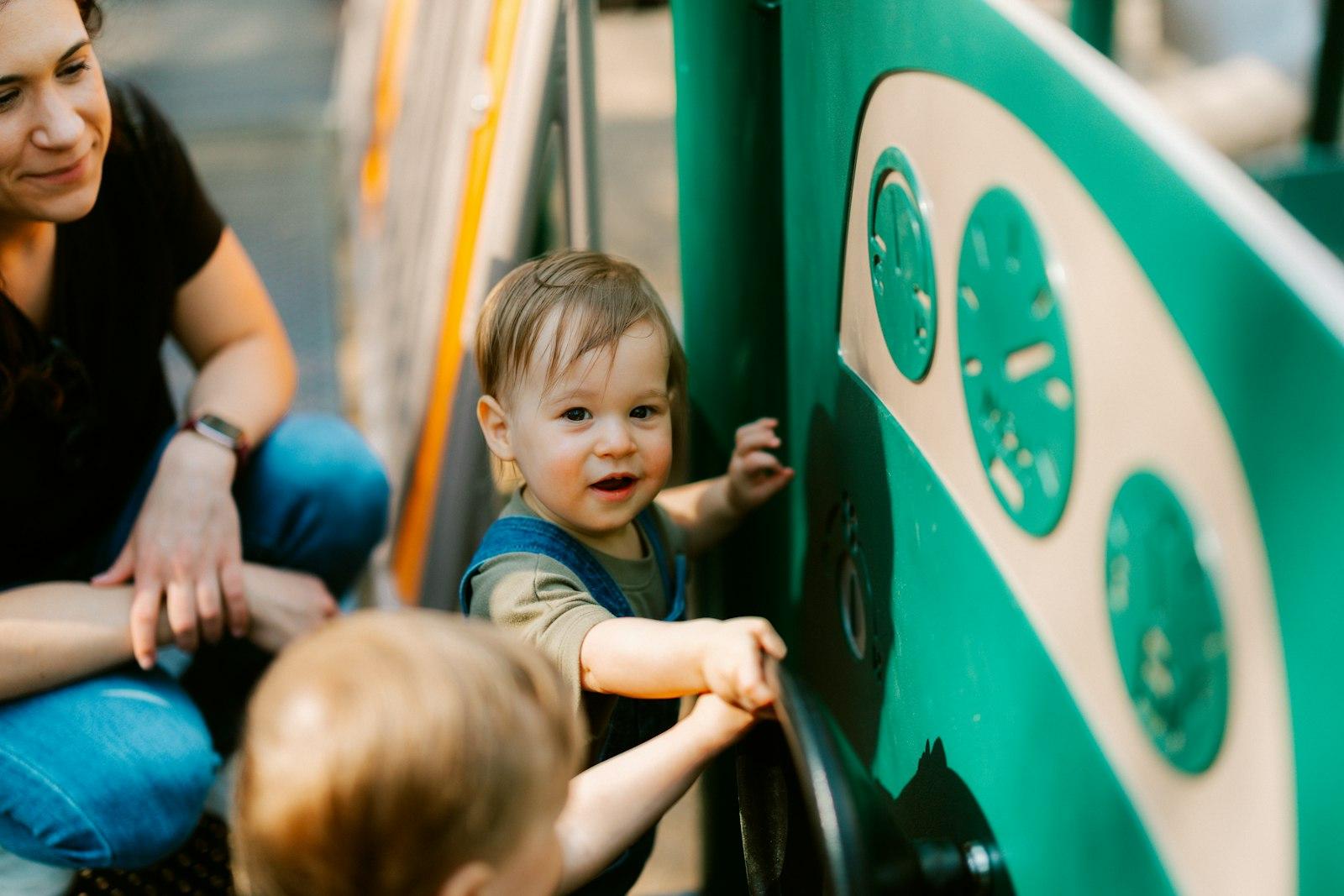 A Woman And Two Babies At A Playground jigsaw puzzle preview