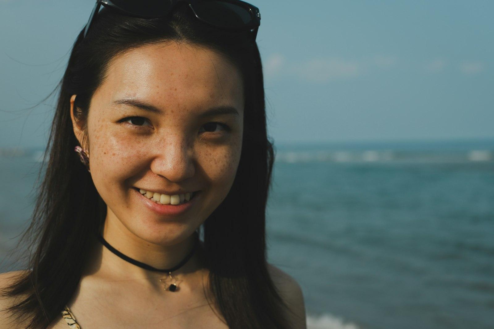 A Woman Standing On A Beach Next To The Ocean jigsaw puzzle preview