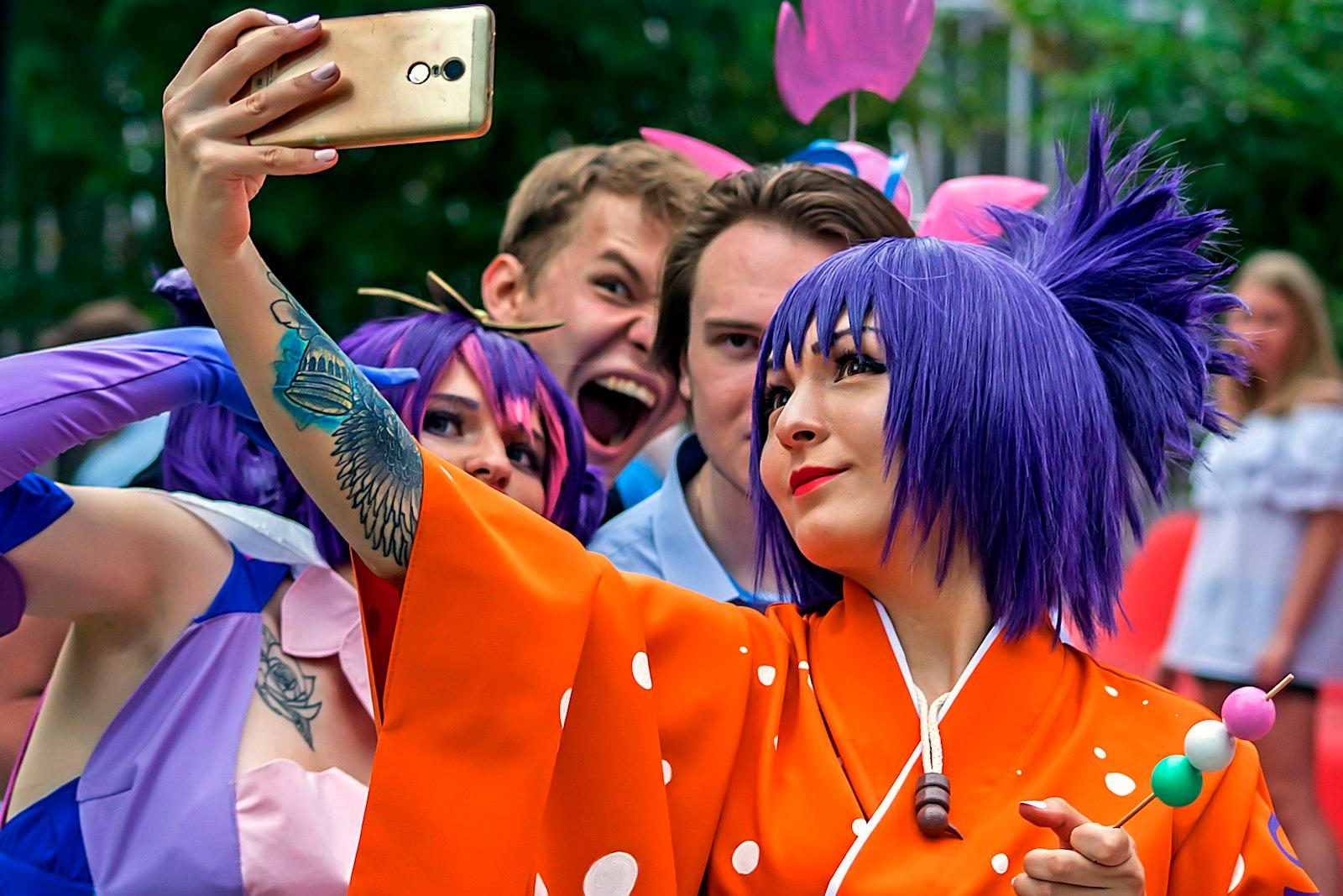 A Woman With Purple Hair Taking A Picture With Her jigsaw puzzle preview
