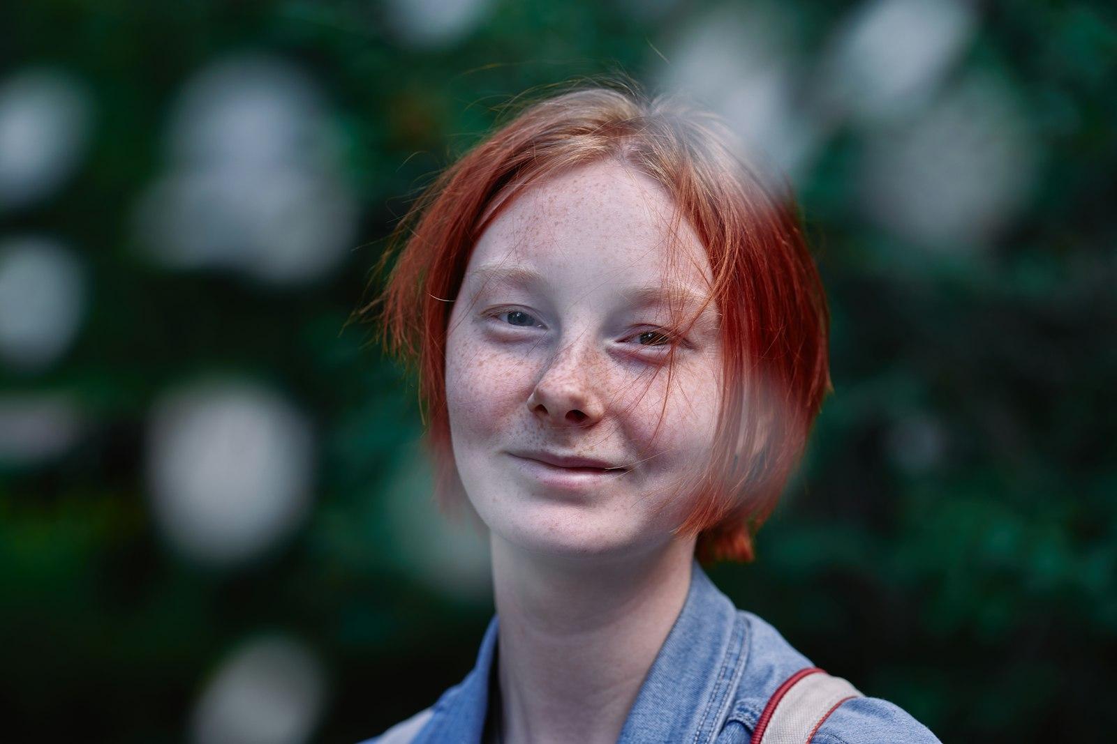 A Woman With Red Hair Is Smiling For The Camera jigsaw puzzle preview