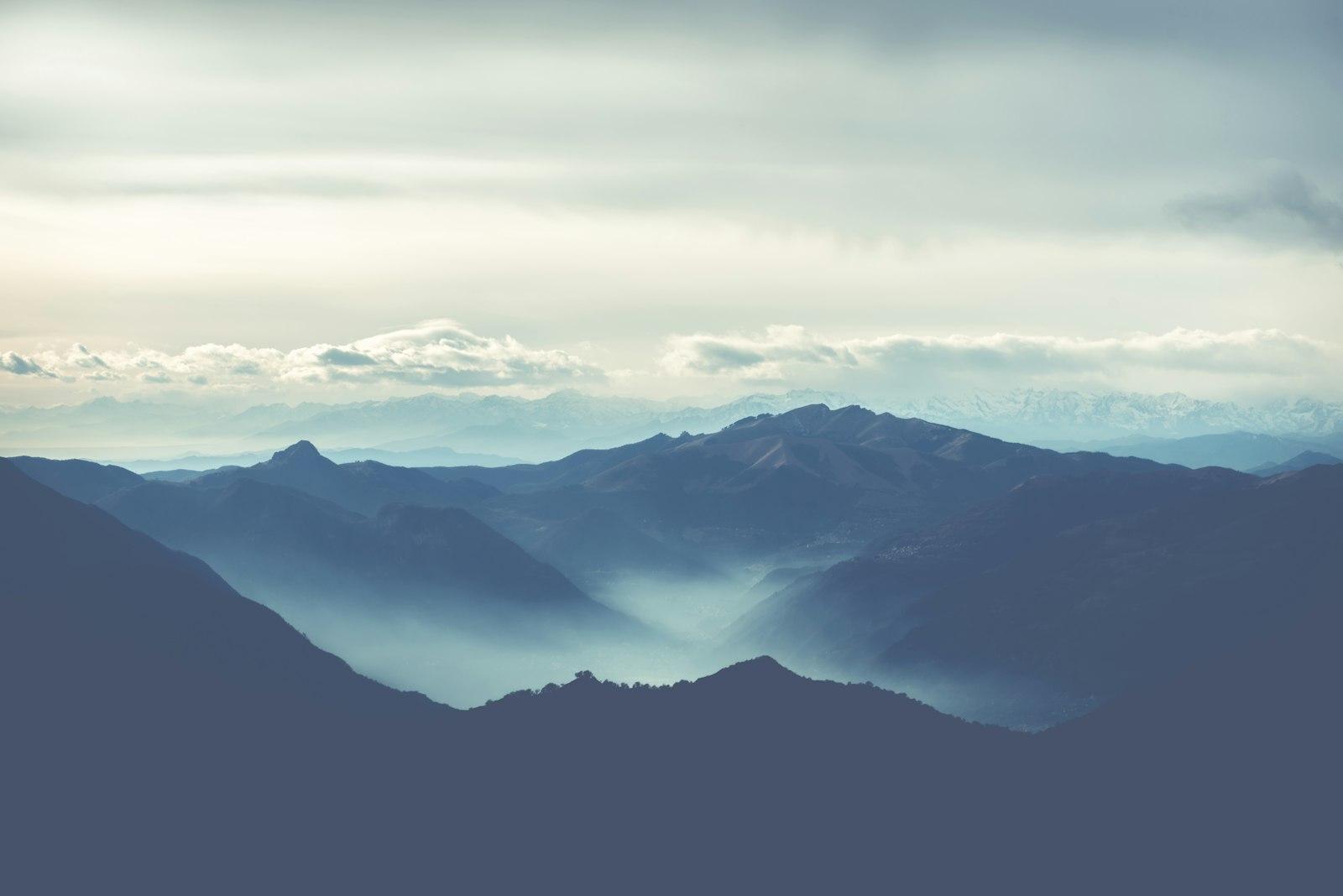 Black Rocky Mountain Under White Cloudy Sky jigsaw puzzle preview