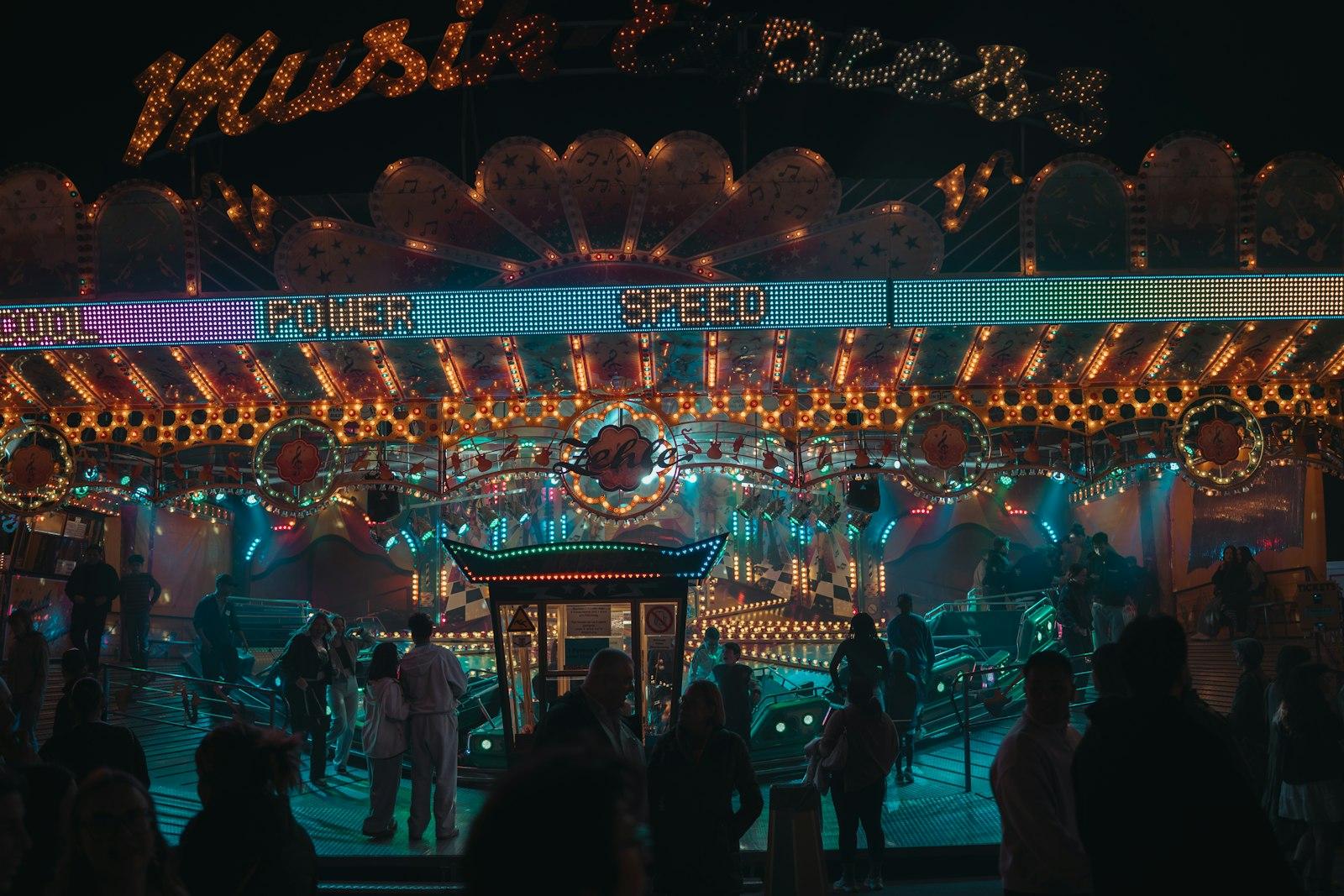 Brightly Lit Amusement Ride At Night With People jigsaw puzzle preview