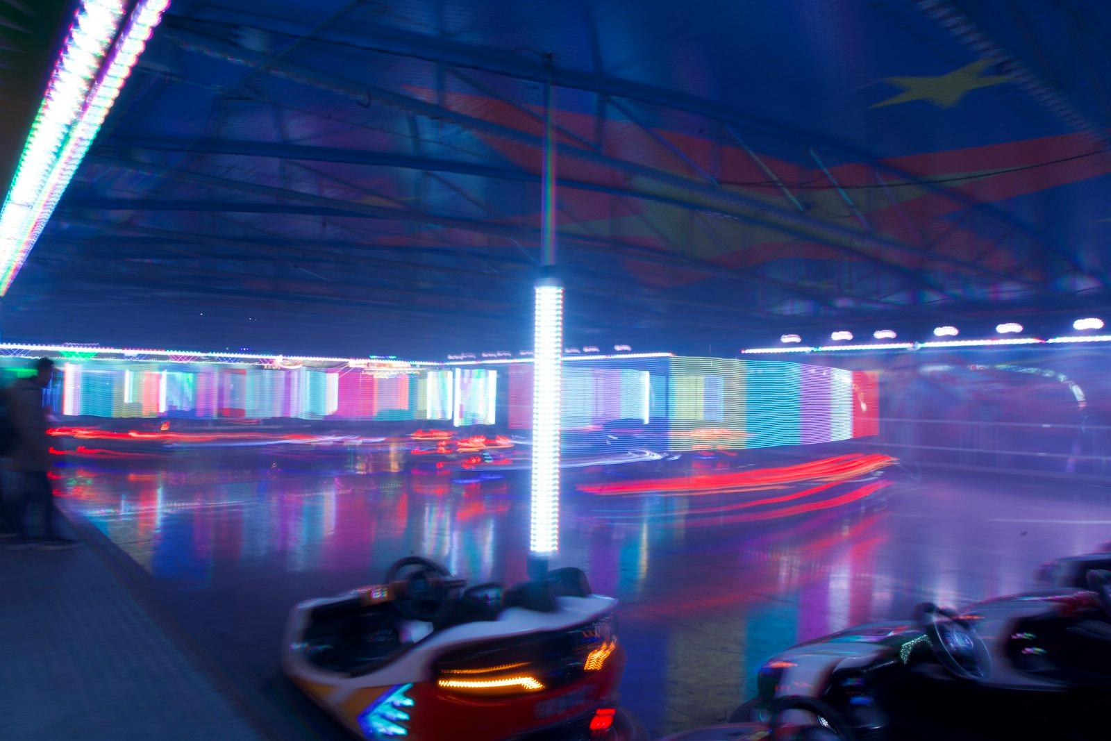 Bumper Cars At An Amusement Park At Night jigsaw puzzle preview