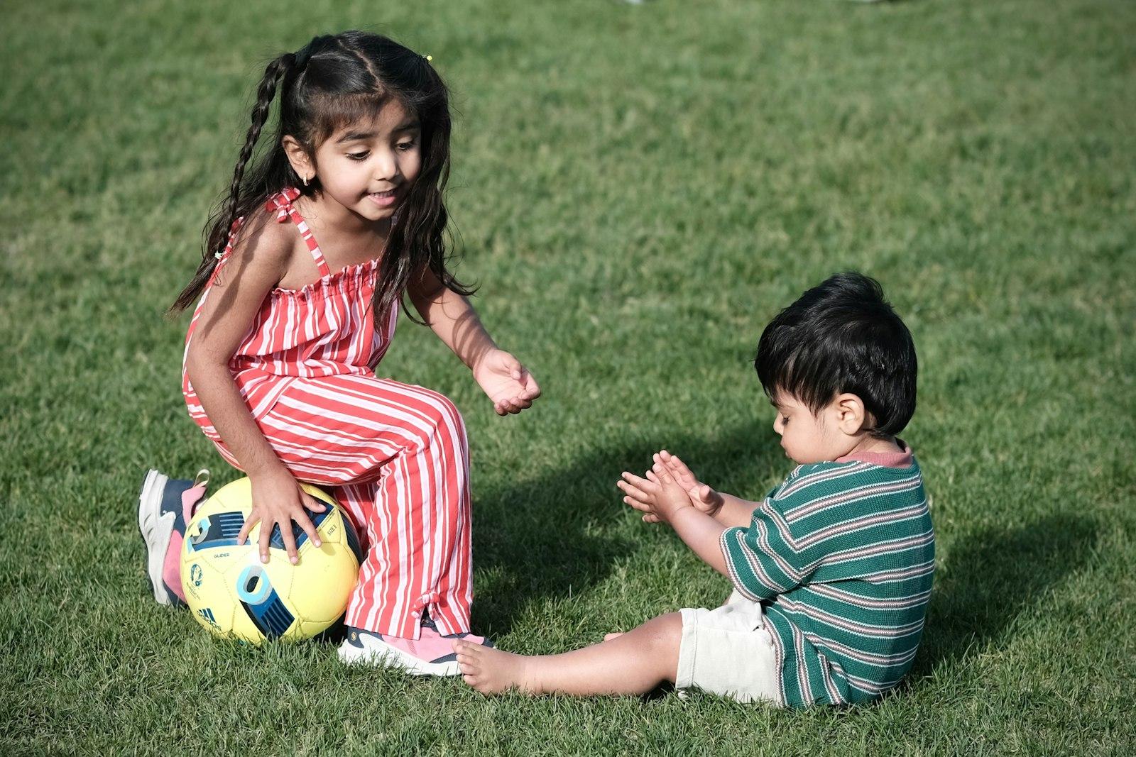 Children Playing With A Soccer Ball On Vibrant Gre jigsaw puzzle preview