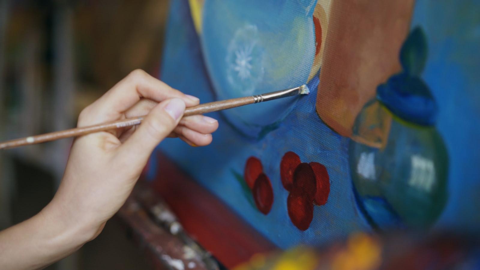 Close-Up Of Woman With Brush Painting Still Life P jigsaw puzzle preview