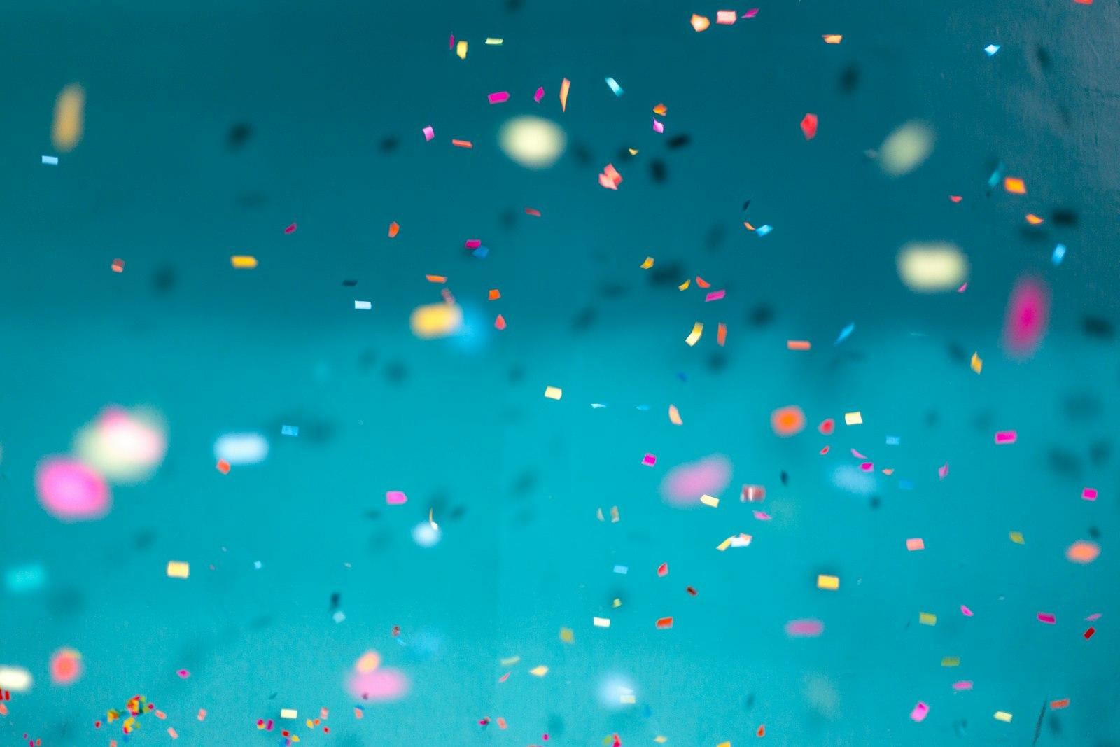 Colorful Confetti Falling Down With A Teal Backgro jigsaw puzzle preview