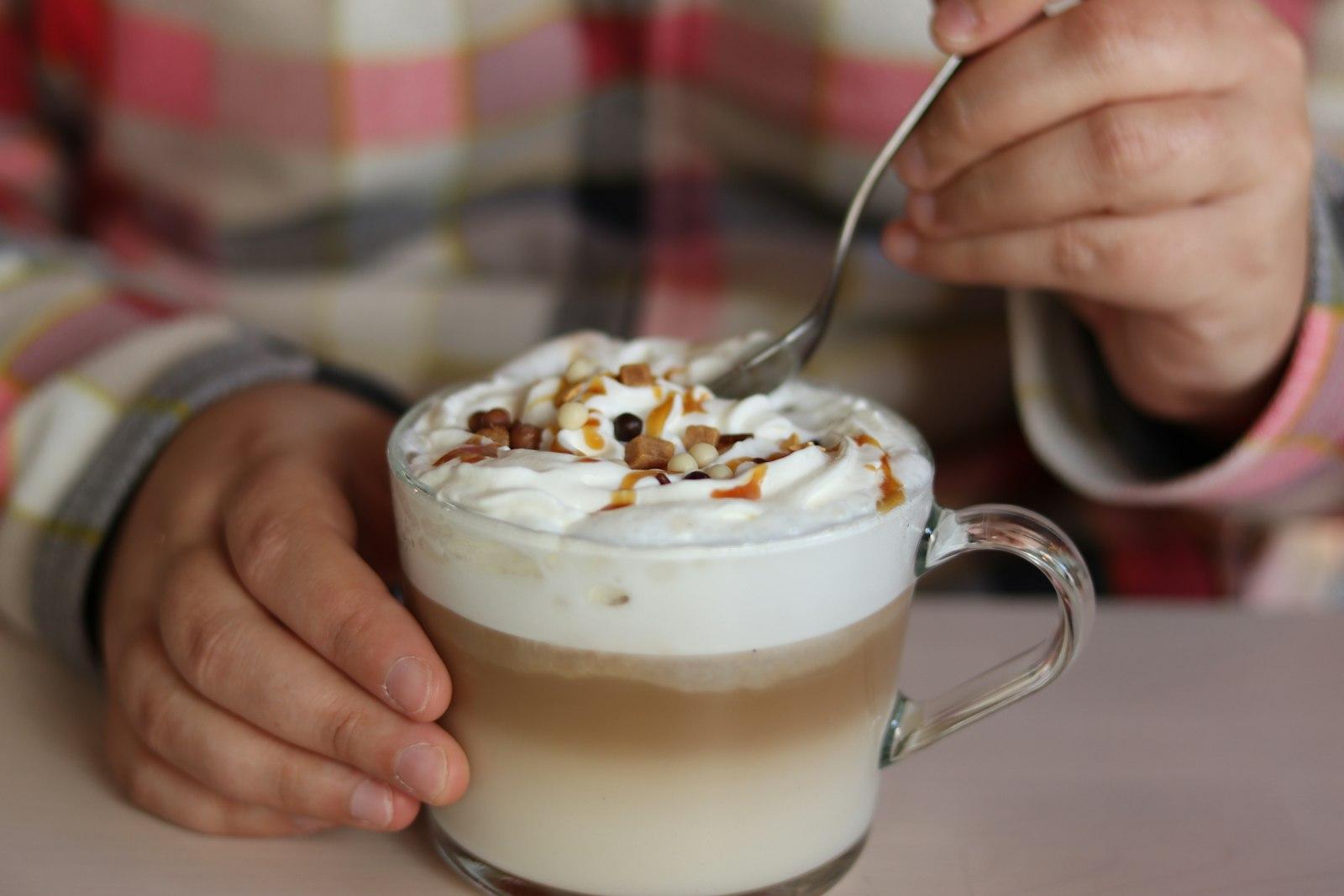 Dipping A Spoon In A Caramel Latte Coffee jigsaw puzzle preview