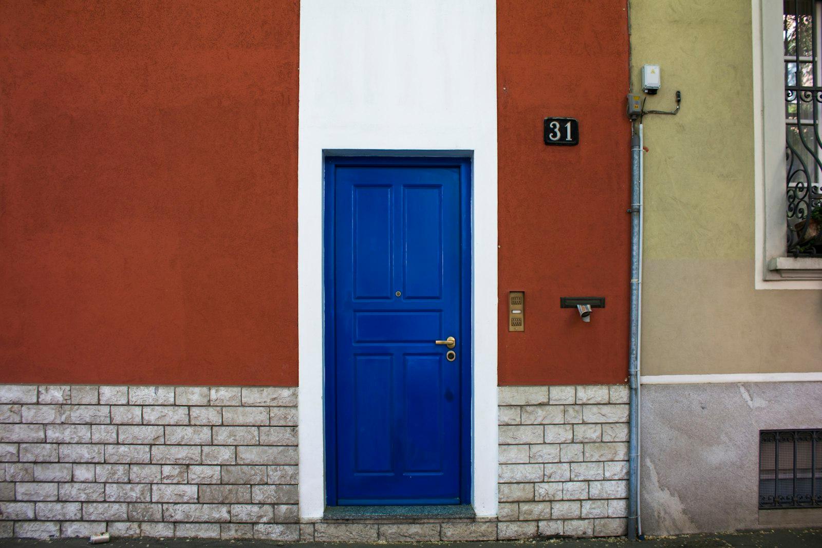 Doors Of Milan. Colorful Blue Door And Red Buildin jigsaw puzzle preview