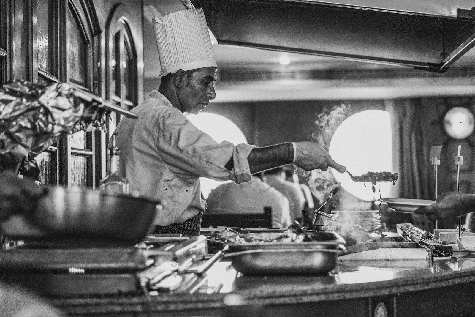 Grayscale Photo Of Man Cooking jigsaw puzzle preview