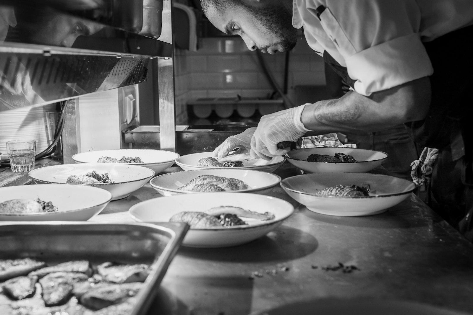 Grayscale Photography Of Person Doing Plating Of D jigsaw puzzle preview