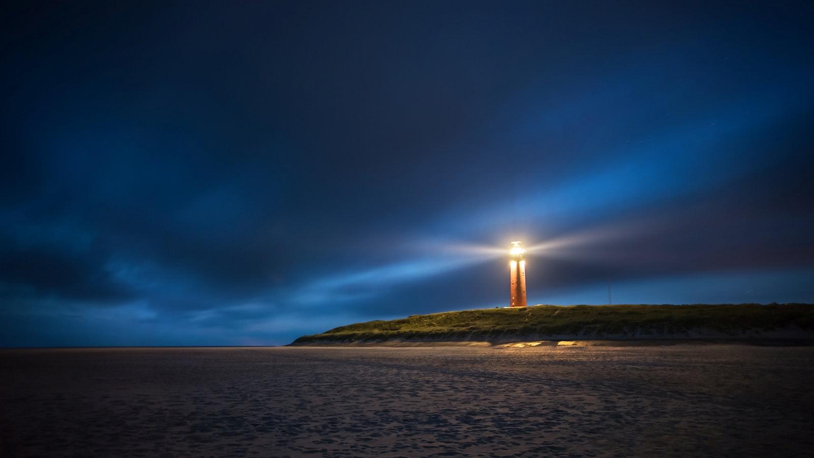 Lighthouse Under Cloudy Sky During Nighttime jigsaw puzzle preview