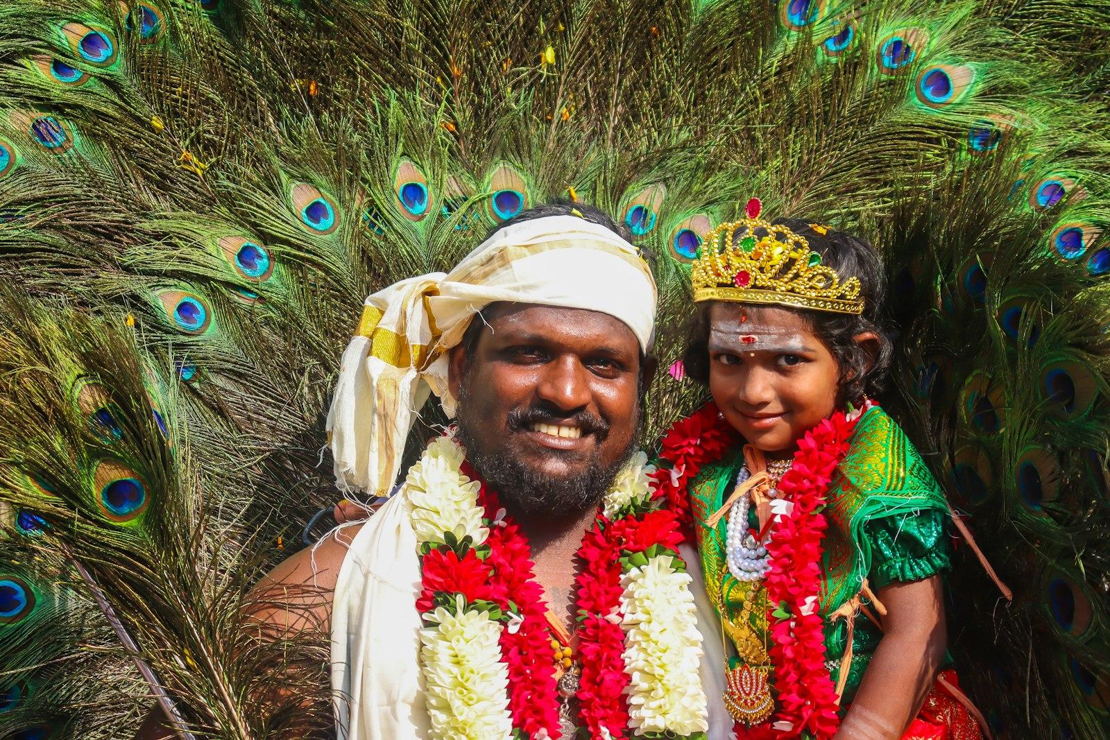 Man And Child With Peacock Feathers And Flower Gar jigsaw puzzle preview