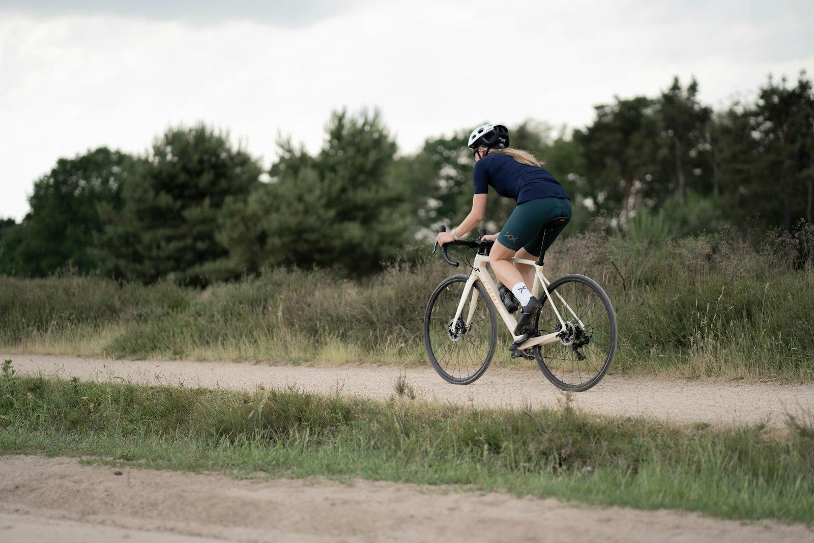 Man In Black T-Shirt Riding On Bicycle During Dayt jigsaw puzzle preview