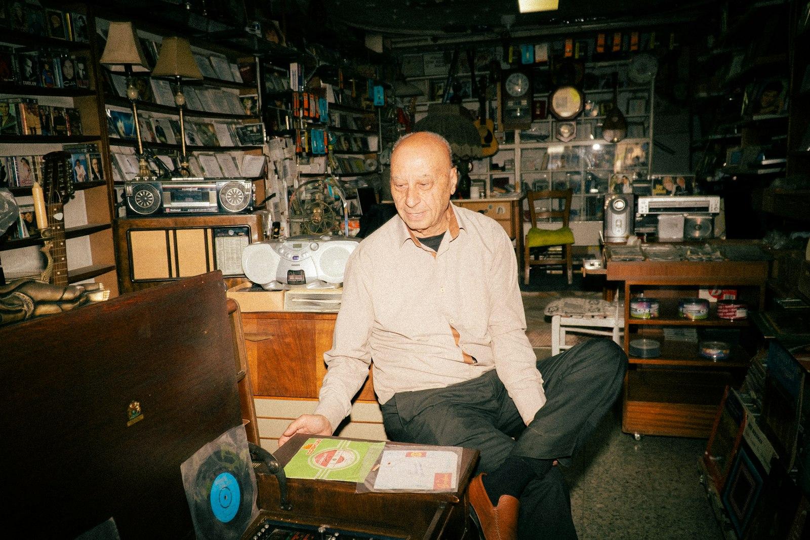 Man Sitting In A Cluttered Antique Store With Reco jigsaw puzzle preview
