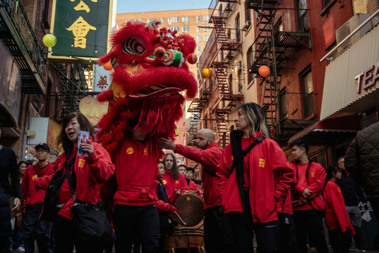 People In Red Perform A Dragon Dance In A Street jigsaw puzzle preview
