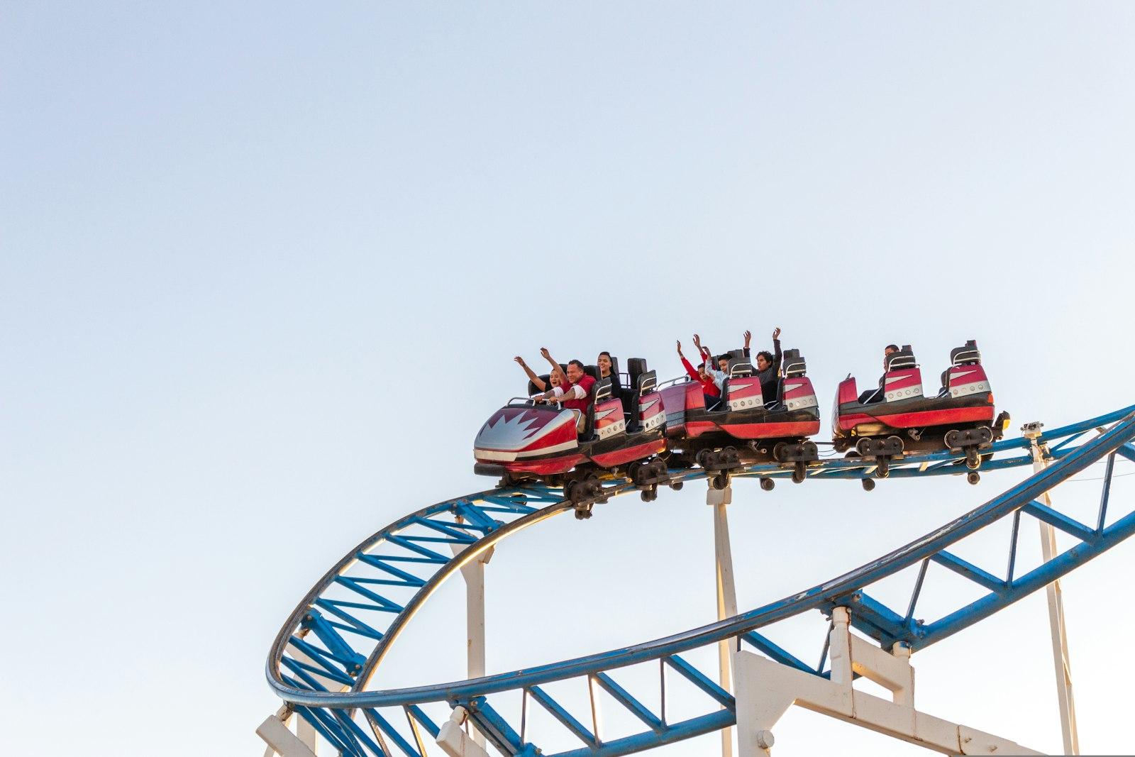 People Riding Red And White Roller Coaster During jigsaw puzzle preview