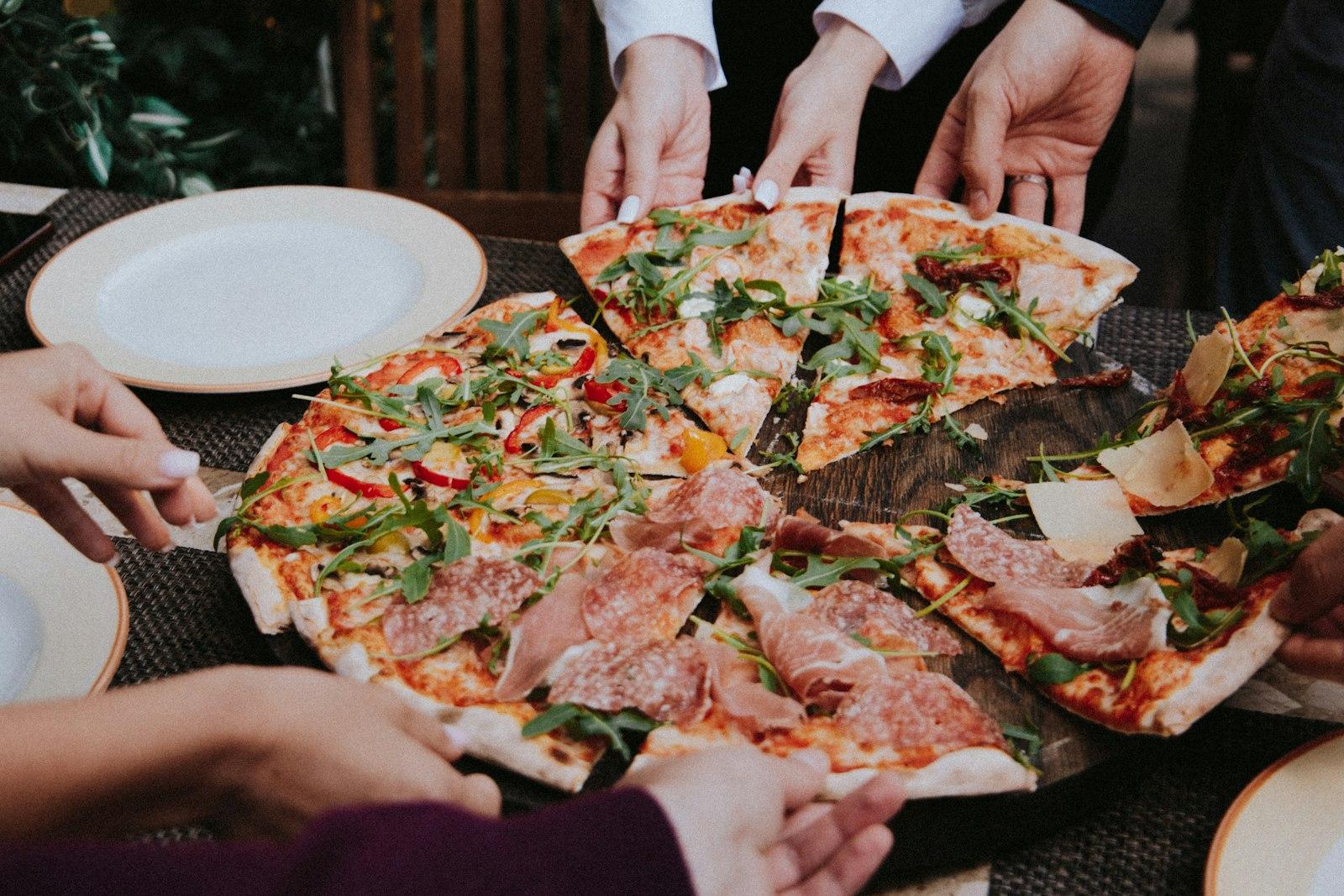 Person Holding Pizza On White Ceramic Plate jigsaw puzzle preview