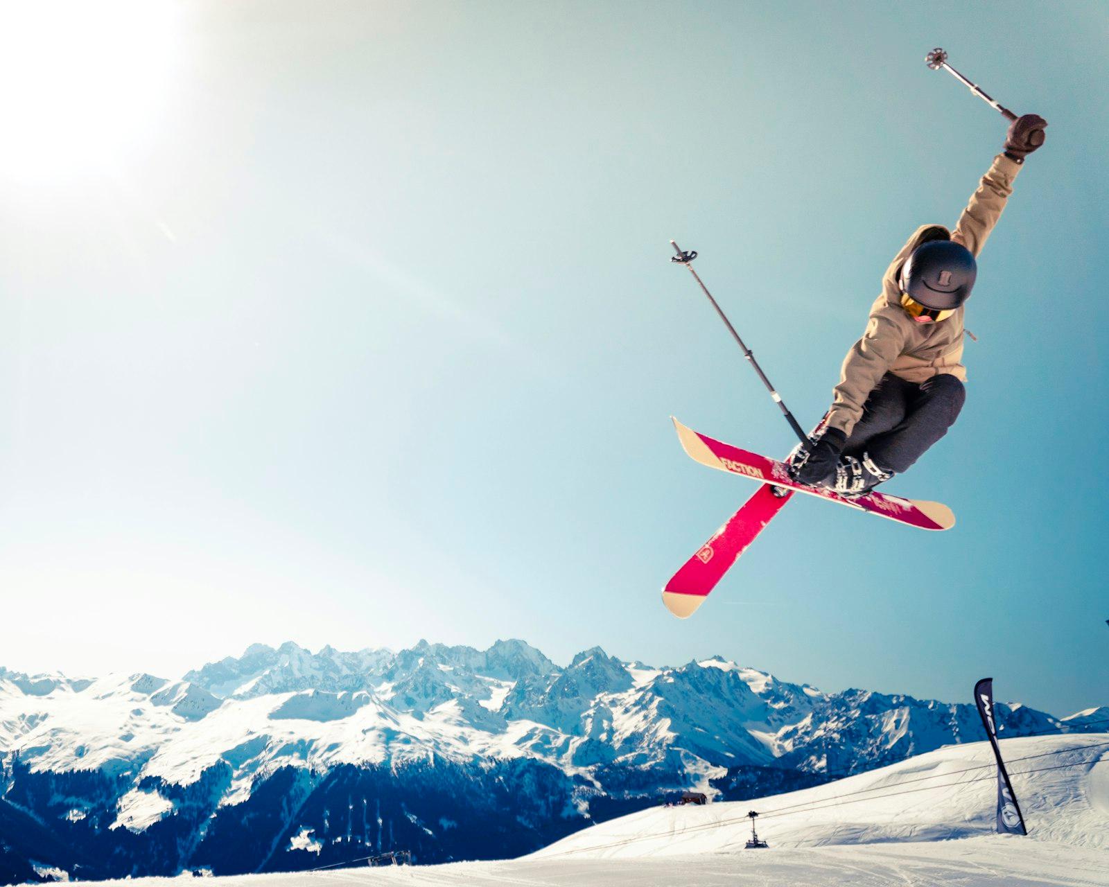 Person In Brown Jacket Doing Snow Ski Blade Trick jigsaw puzzle preview