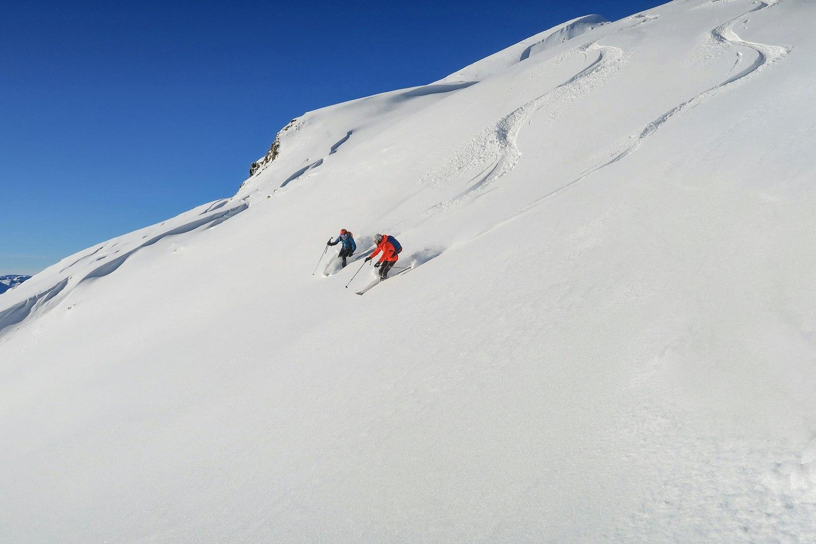 Person In Red Jacket And Blue Pants On Snow Covere jigsaw puzzle preview