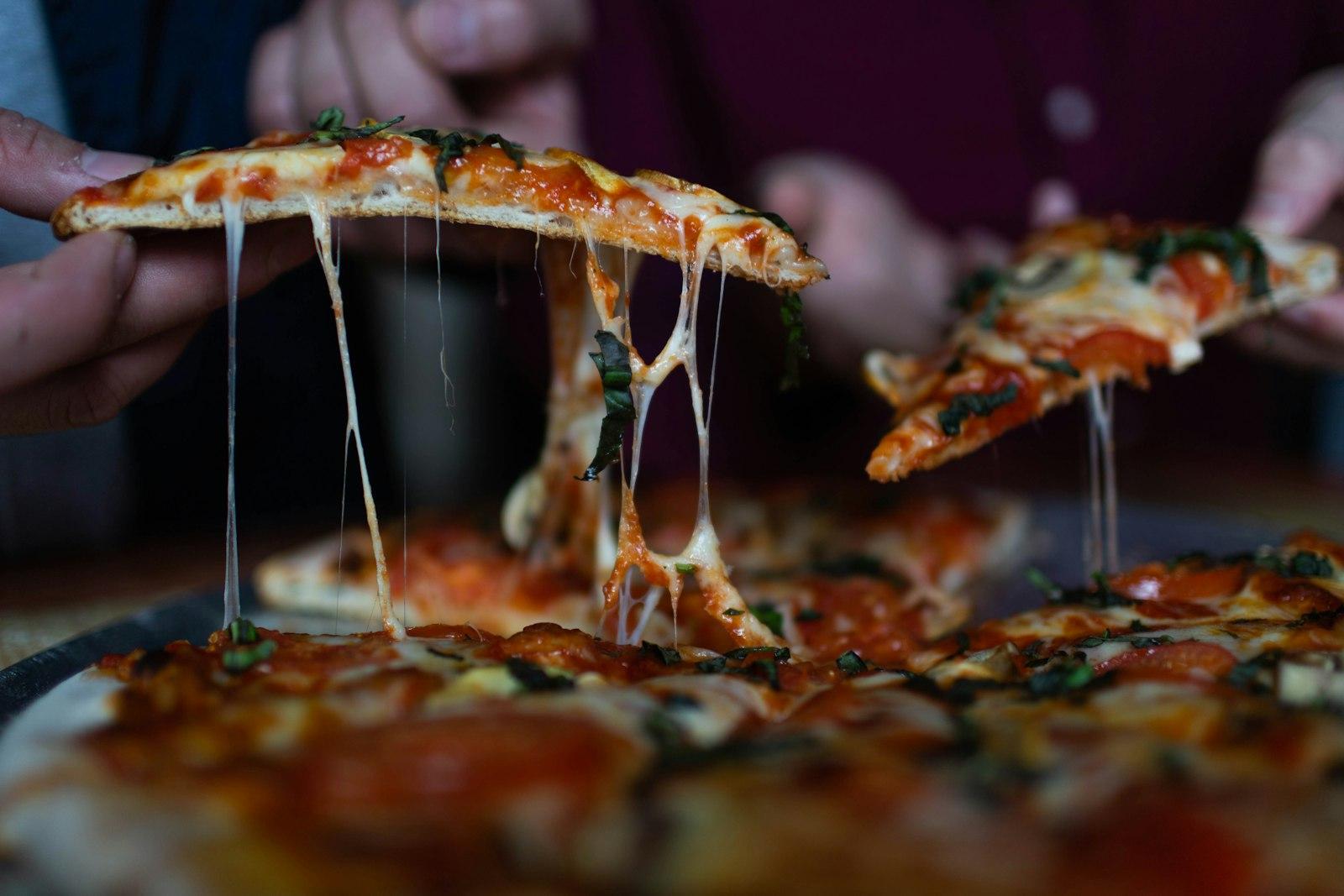 Person Picking Sliced Pizza jigsaw puzzle preview