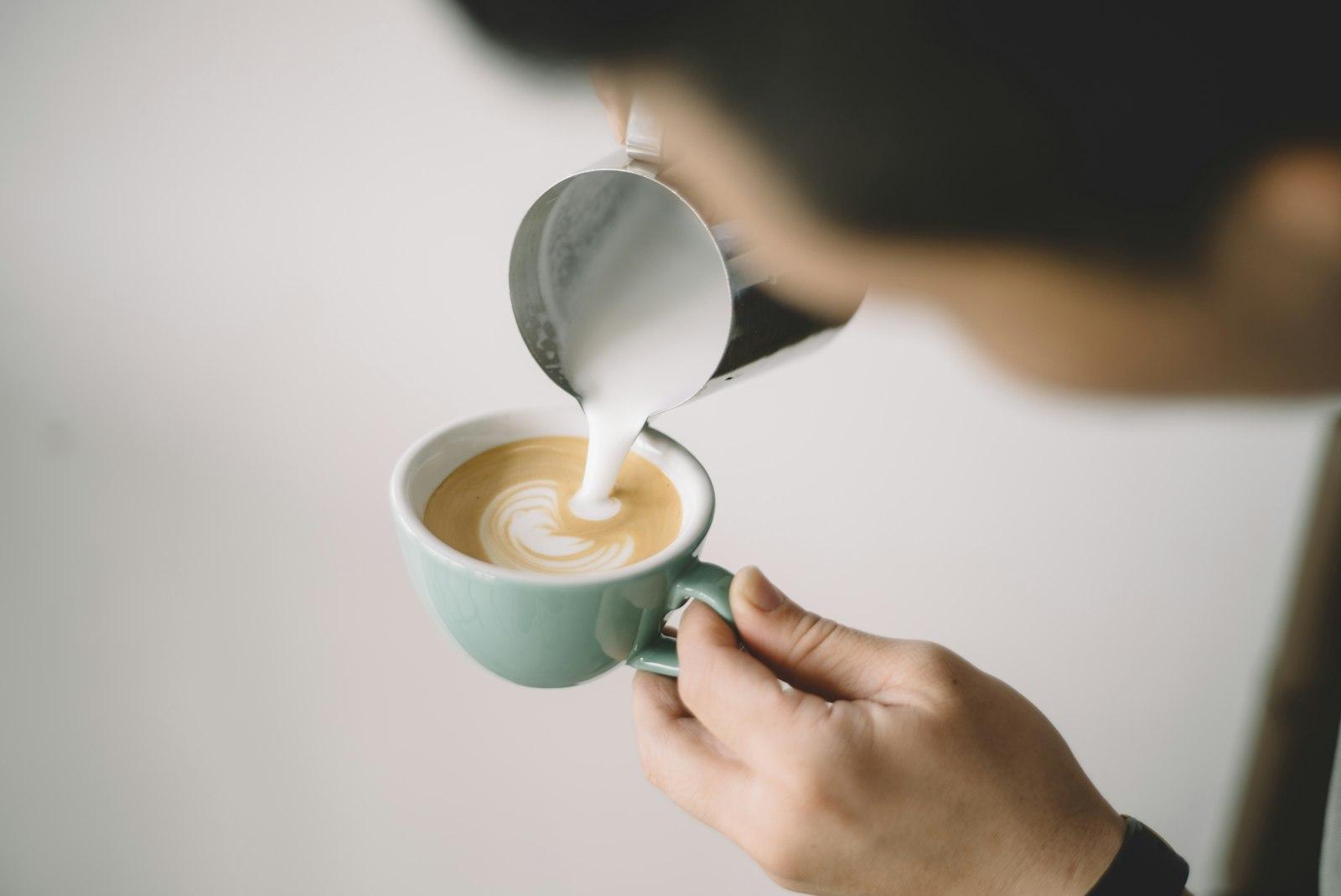 Person Pouring Coffee On White Ceramic Mug jigsaw puzzle preview