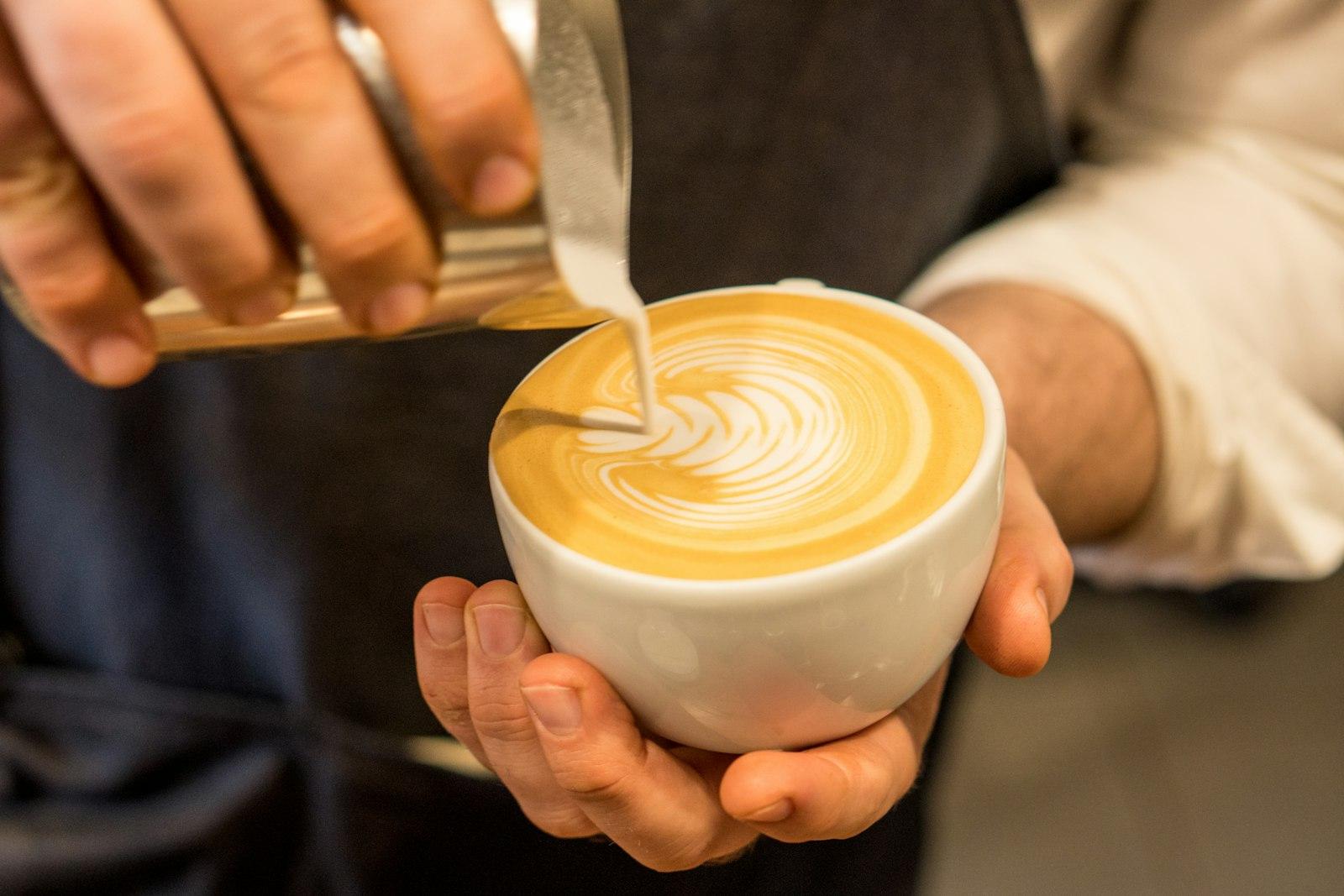 Person Pouring Cream On Coffee jigsaw puzzle preview