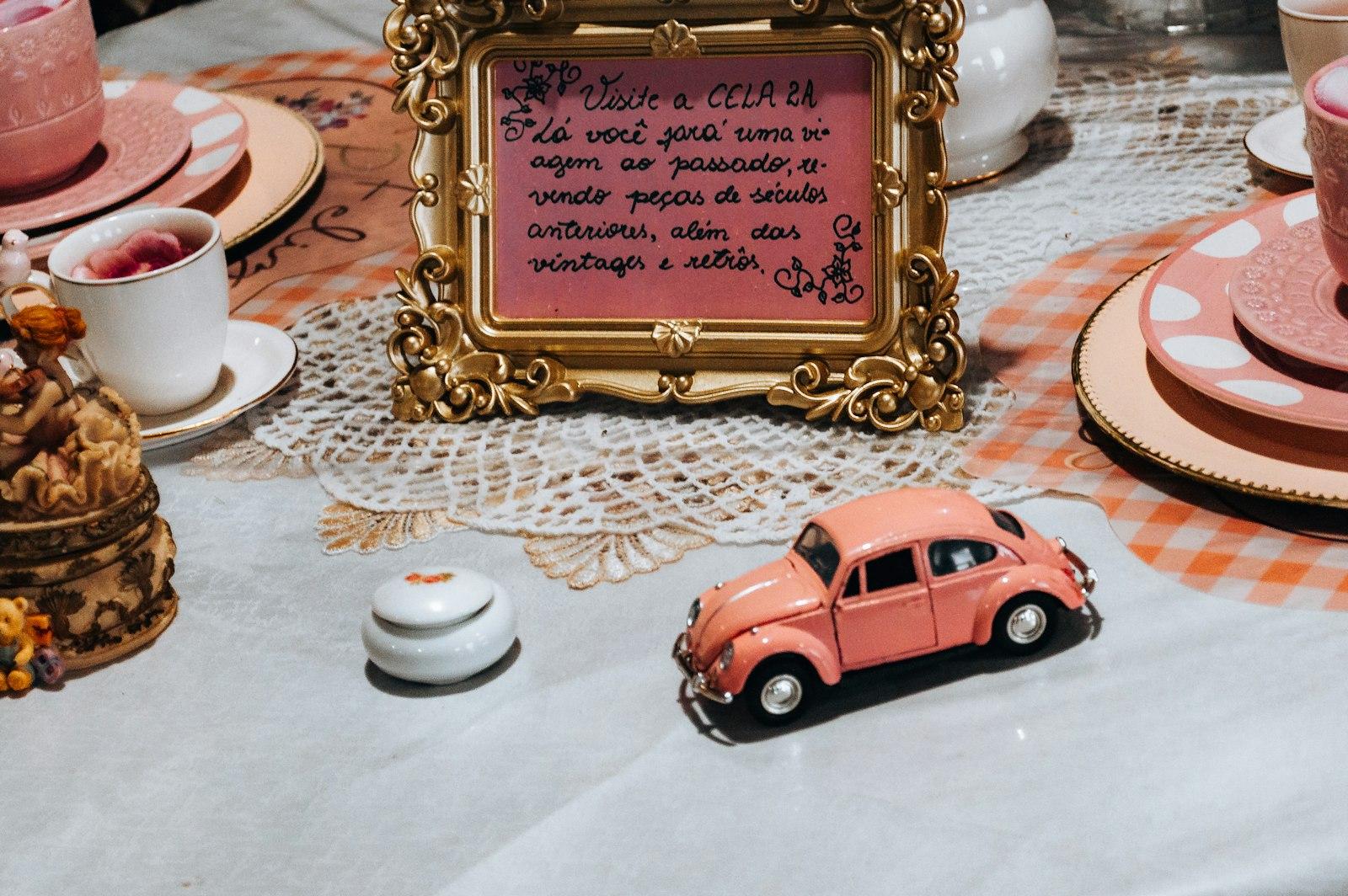 Pink Toy Car And Decorative Items On A Table jigsaw puzzle preview