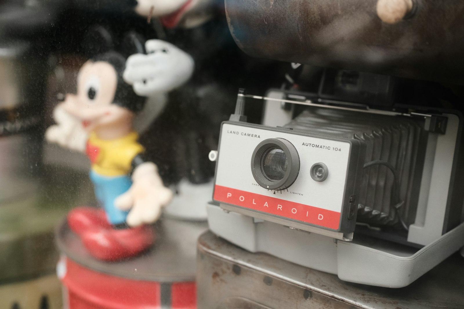 Polaroid Camera And Toy Figures In Display jigsaw puzzle preview